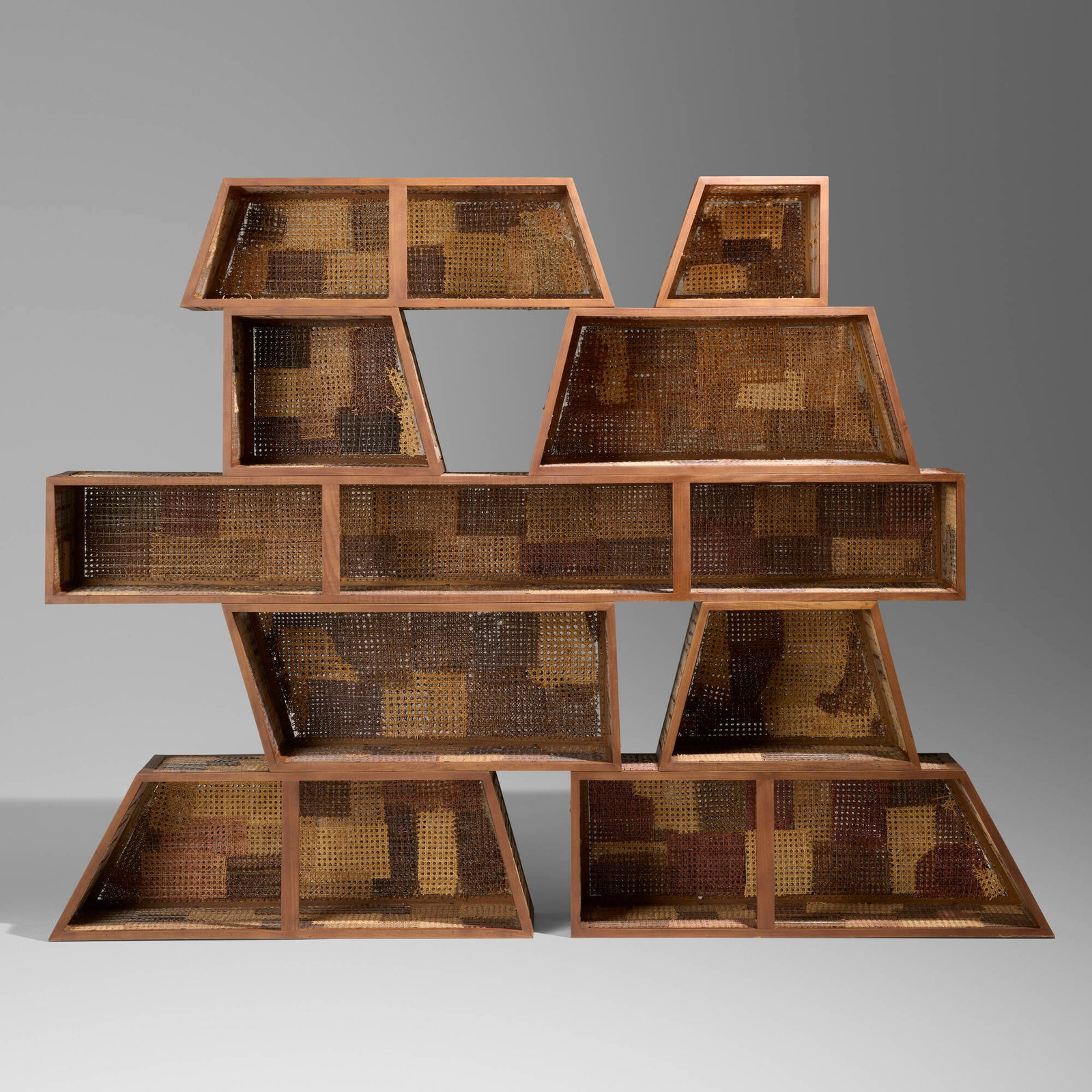 Fernando and Humberto Campana, Prototype Detonado Modular Bookshelf 1: Fernando and Humberto Campana Prototype Detonado Modular Bookshelf 1 Brazil, 2015 freijo wood, reclaimed Thonet wicker, and nylon cord 70.5 h x 91.75 w x 15.75 d in (179 x 233 x 40 cm) Carved