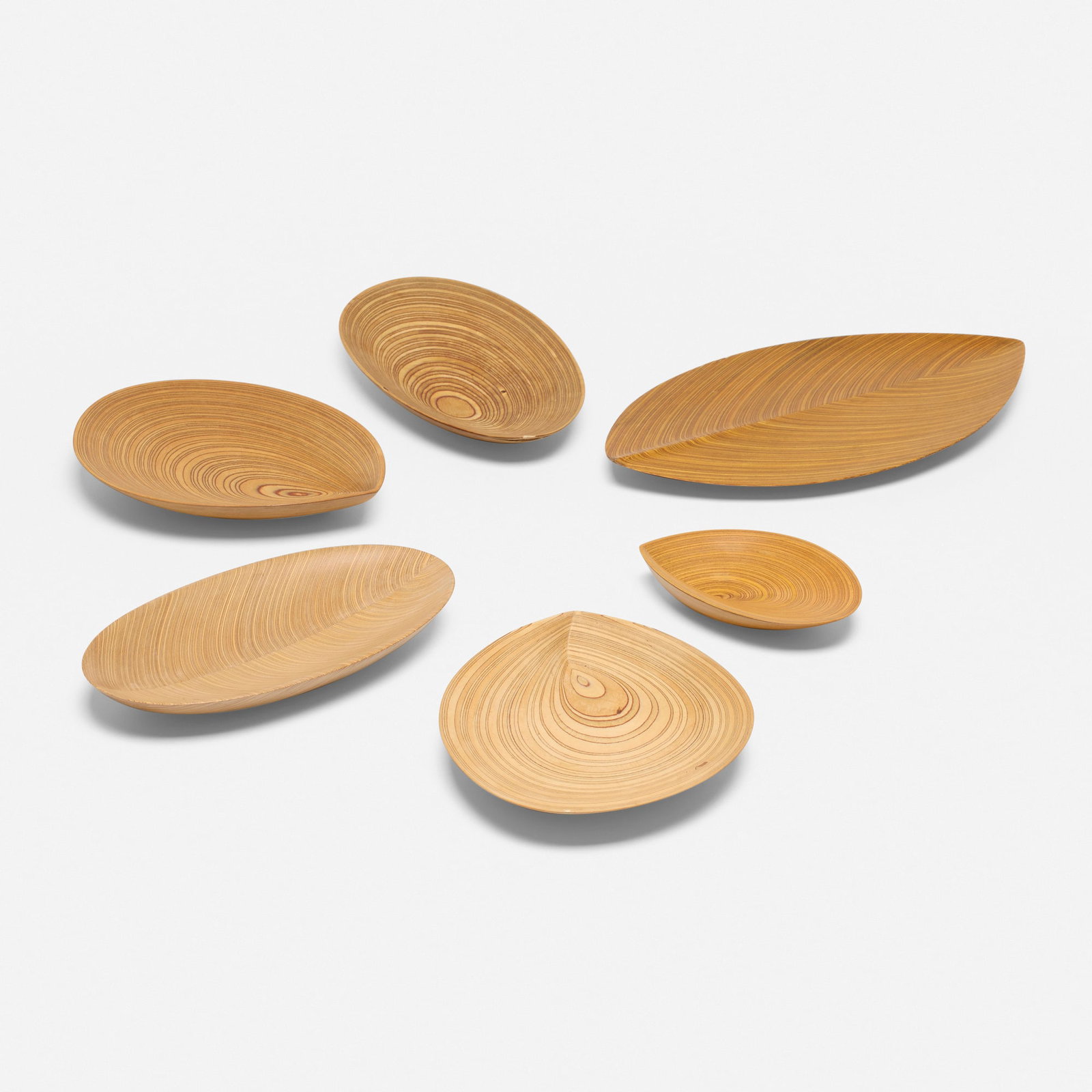 Tapio Wirkkala, Collection of six leaf trays: Tapio Wirkkala Collection of six leaf trays Soinne & Kni Oy Finland, c. 1951 laminated birch, teak, and hazel wood largest: 1 h x 18.625 w x 9.75 d in (3 x 47 x 25 cm) smallest: 1.125 h x 7 w x 5.5