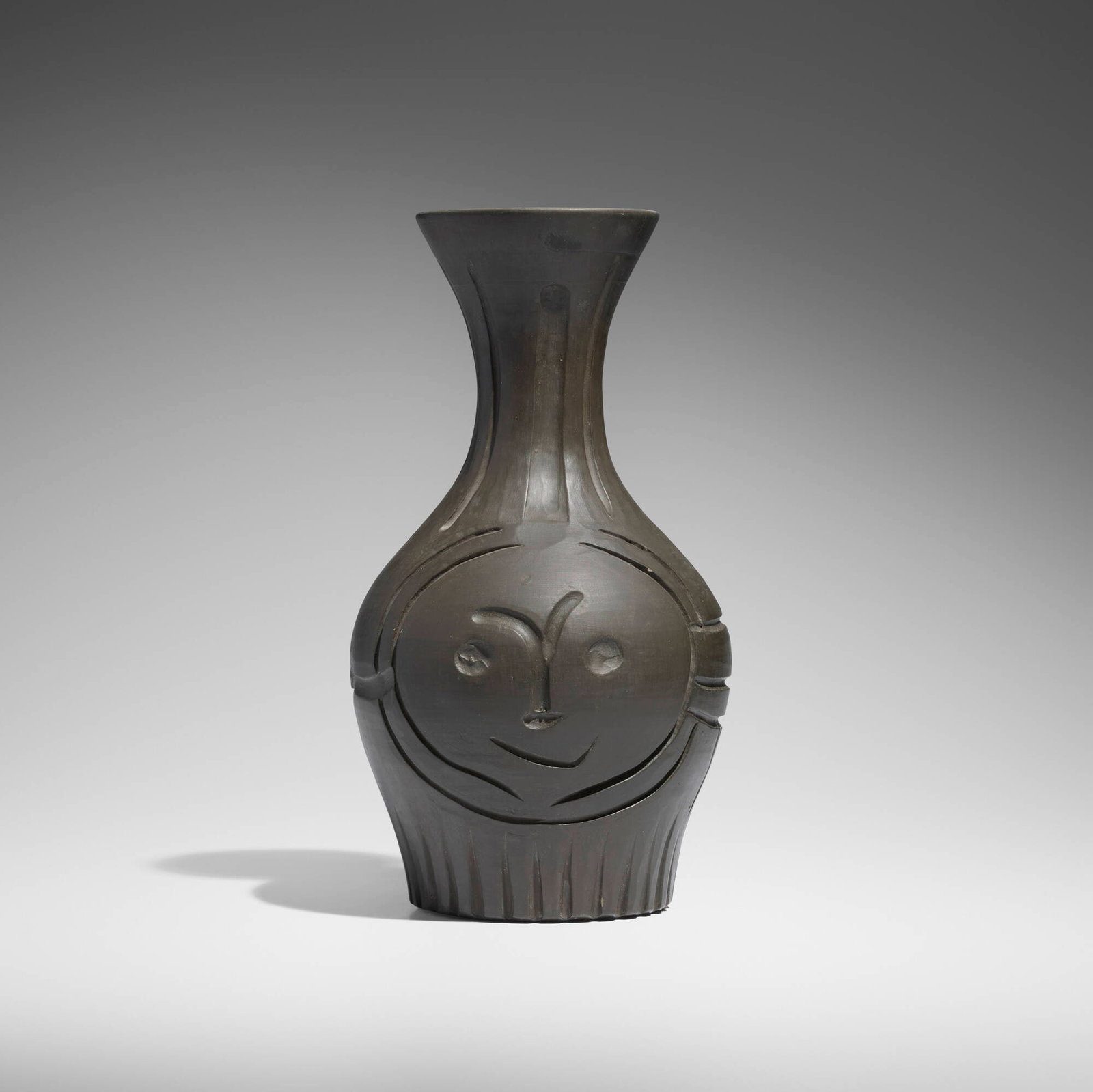 Pablo Picasso, Visage grave noir: Pablo Picasso Visage grave noir 1953 white earthenware with engobe decoration 14 h x 7.75 dia in (36 x 20 cm) Incised studio mark and number to underside 'Edition Picasso 62/100