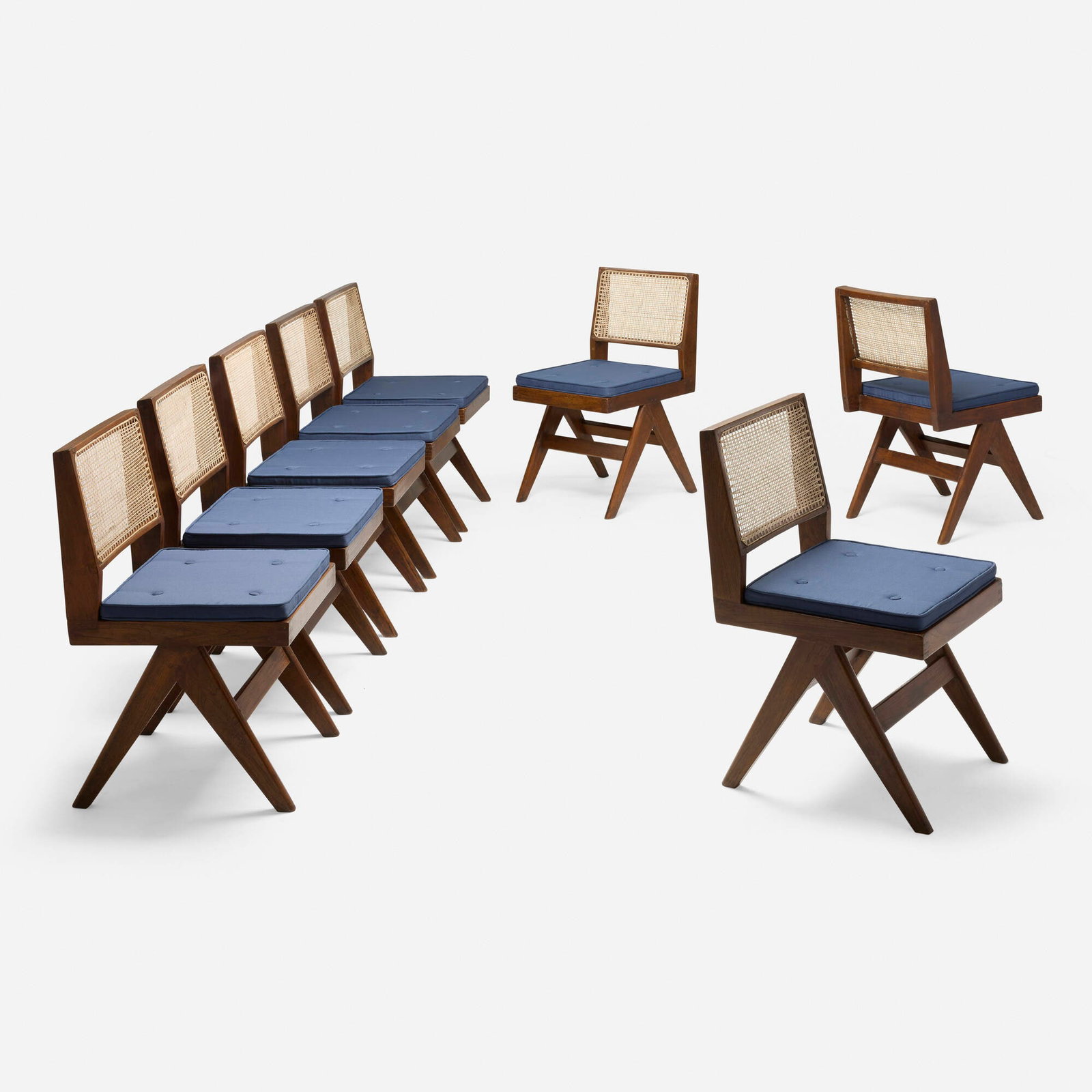 Pierre Jeanneret, Dining chairs from Punjab University Student Residence, Chandigarh, set of eight: Pierre Jeanneret Dining chairs from Punjab University Student Residence, Chandigarh, set of eight France/India, c. 1958-59 teak, cane, linen upholstery 34 h x 18 w x 21.5 d in (86 x 46 x 55 cm) 