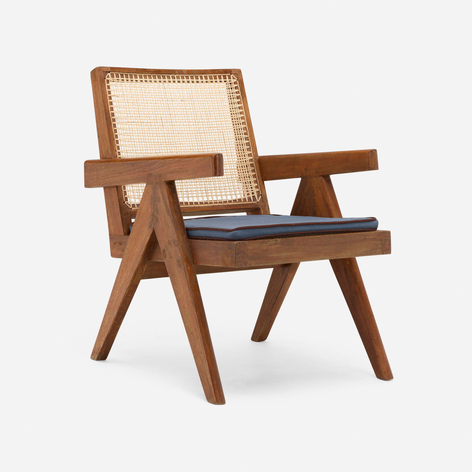 Pierre Jeanneret, Lounge chair from the Punjab Engineering College, Chandigarh: Pierre Jeanneret Lounge chair from the Punjab Engineering College, Chandigarh France/India, c. 1955teak, cane, upholstery 30 h x 20.5 w x 25 d in (76 x 52 x 63 cm) Provenance: