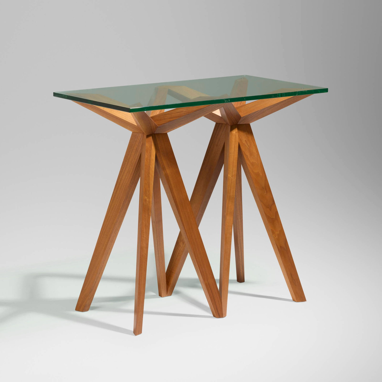Joseph Walsh, Prism console table: Joseph Walsh Prism console table Ireland, c. 2011 walnut, glass 37 h x 39.75 w x 22.75 d in (94 x 101 x 58 cm) Provenance: Cristina Grajales, New York This