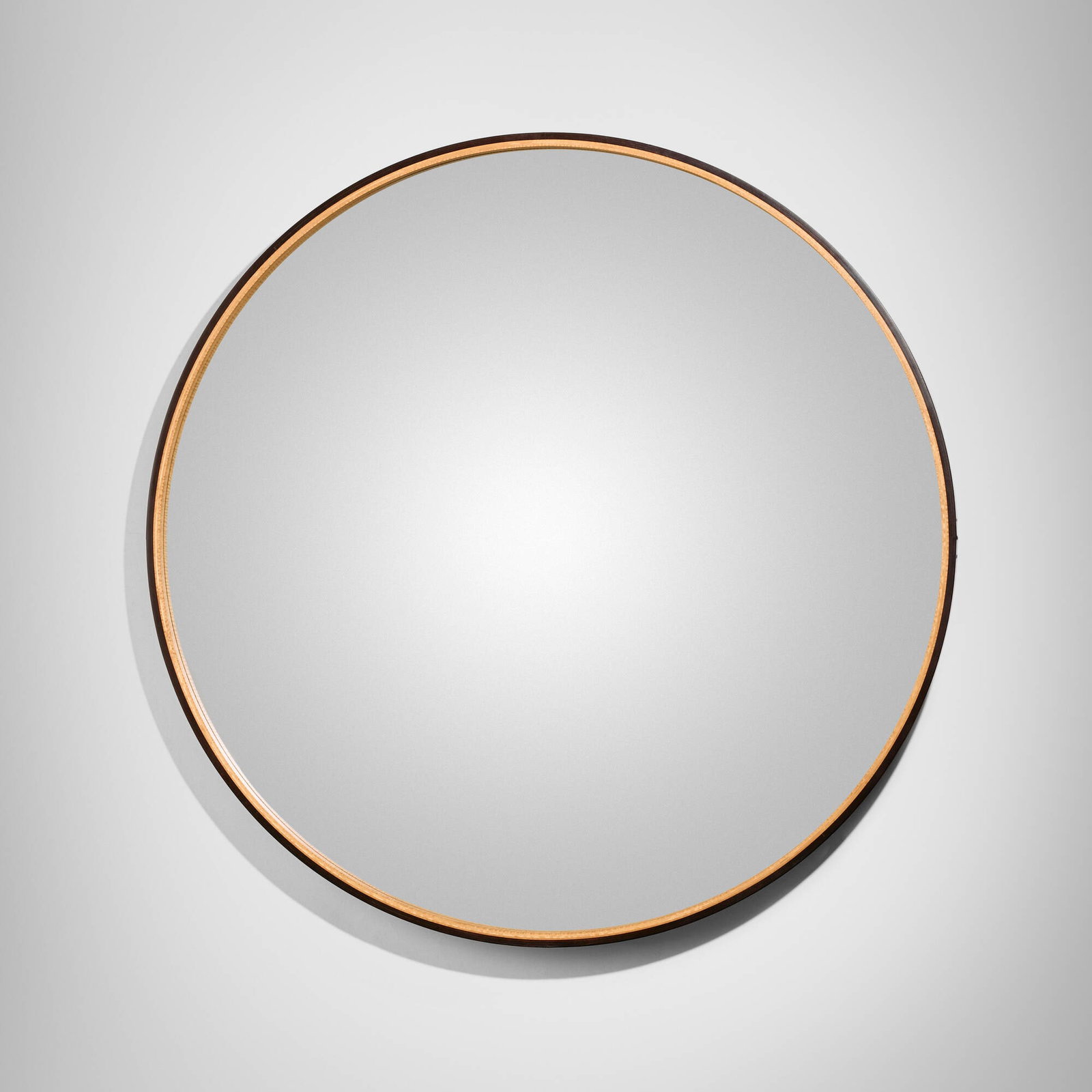 Tyler Hays, Admiral's wall mirror: Tyler Hays Admiral's wall mirror BDDW USA, 2012 dark mulled distressed leather, tiger maple, red oak, mirrored glass, fabric 4 d x 49 dia in (10 x 124 cm) Signed, dated, and inscribed to reverse