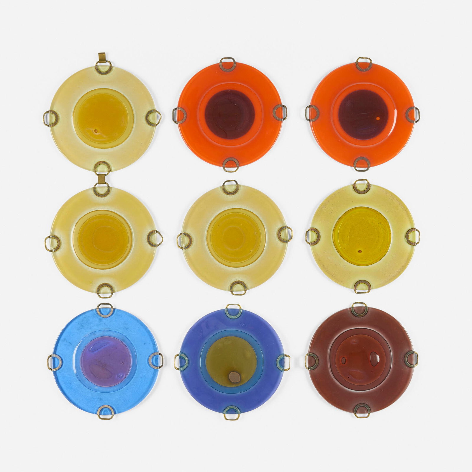 Michael and Frances Higgins, Collection of nine rondelays: Michael and Frances Higgins Collection of nine rondelays Higgins Glass Studio c. 1960 fused glass, brass each: 6 h x 6 w x 0.5 d in (15 x 15 x 1 cm) overall: 18.5 h x 18.5 w x 0.5 d in (47 x 47 x 1