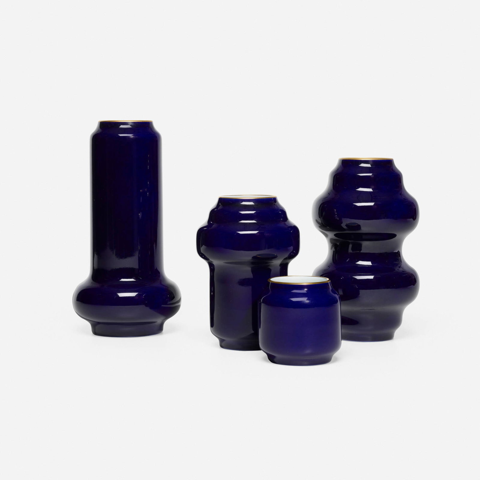 Francois Dumas, Collection of four Superimposed vases: Francois Dumas Collection of four Superimposed vases Manufacture Nationale de Sevres France, 2011 / 2013 glazed and gilt porcelain largest: 11.5 h x 6 dia in (29 x 15 cm) smallest: 4 h x 3.5 dia in