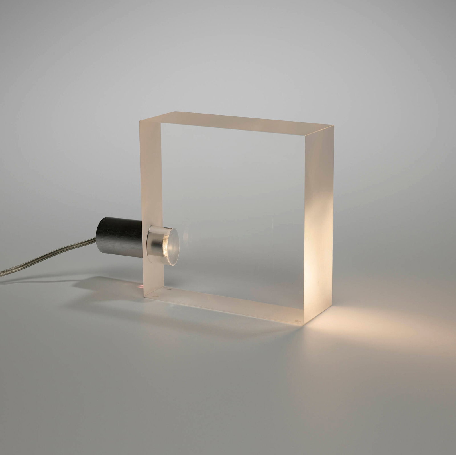 Tokujin Yoshioka, ToFU table lamp: Tokujin Yoshioka ToFU table lamp Yamagiwa Corporation Japan, 2000 acrylic, aluminum 8.25 h x 11 w x 2.875 d in (21 x 28 x 7 cm) An example of this design is in the permanent collection of the Cooper