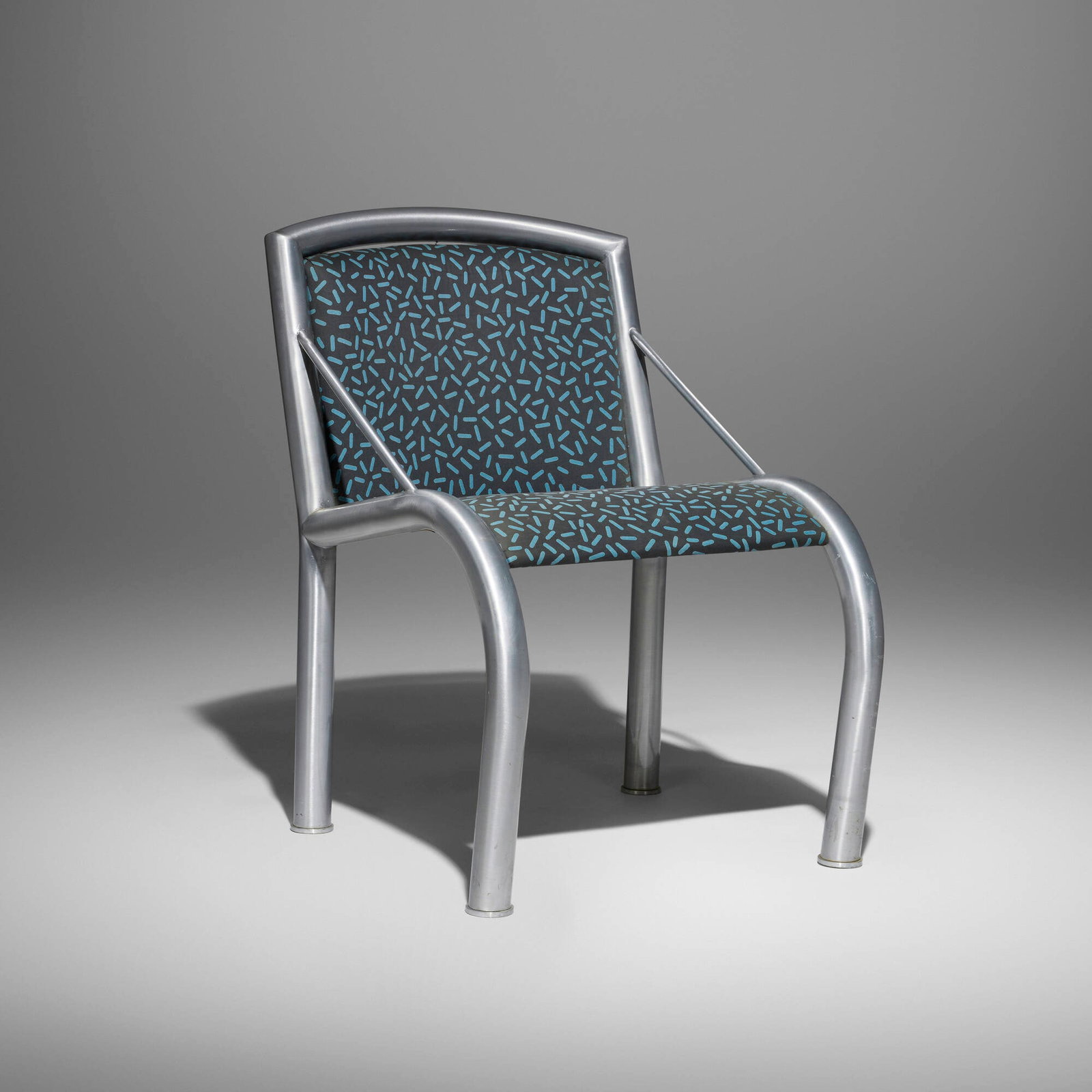 Marco Zanini, Lucrezia chair: Marco Zanini Lucrezia chair Memphis Italy, 1984 aluminum, upholstery 31.25 h x 21.5 w x 30 d in (79 x 55 x 76 cm) Chair features Letraset fabric designed by Ettore Sottsass. Stamped manufa