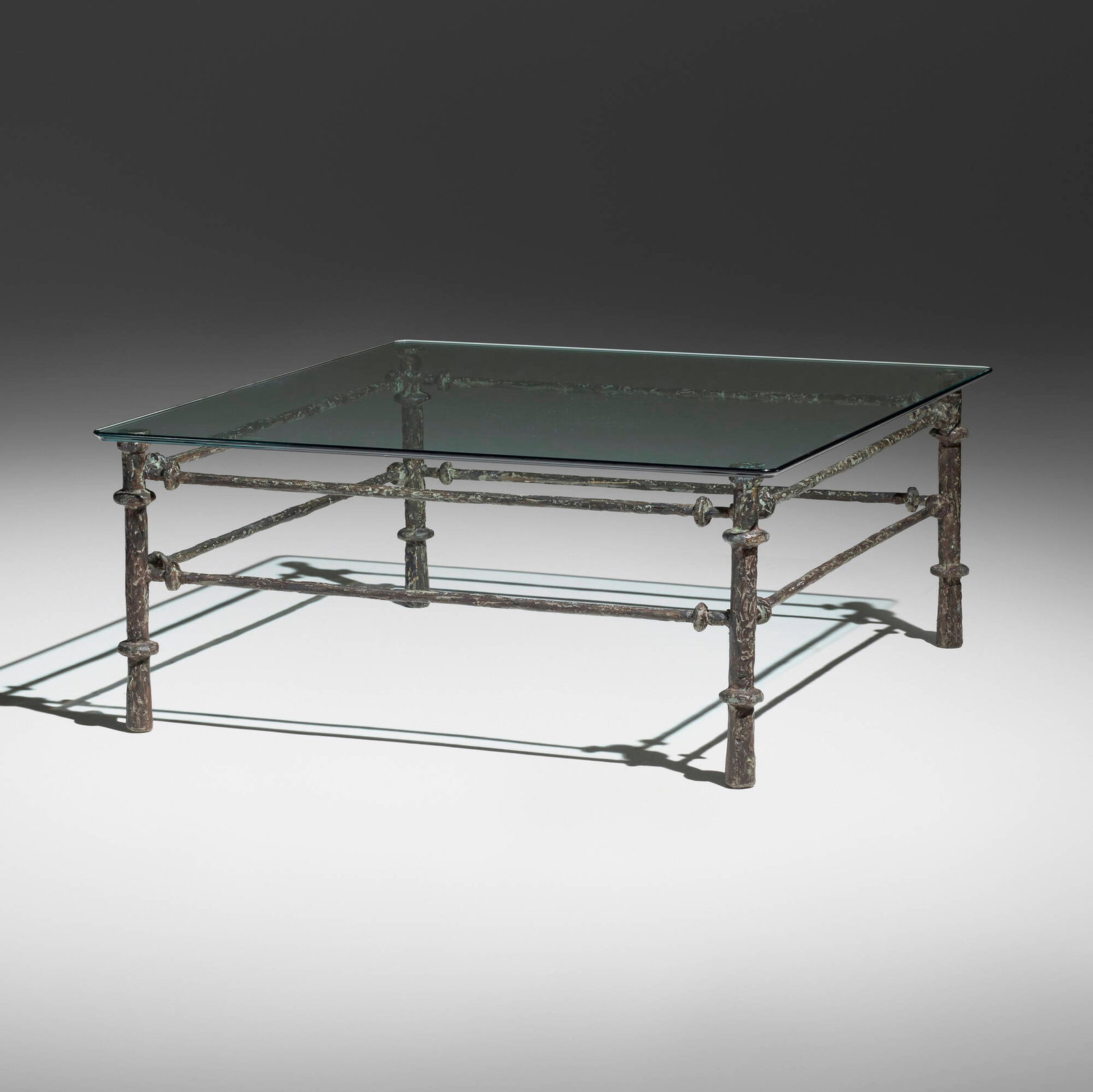 In the manner of Diego Giacometti, Coffee table: In the manner of Diego Giacometti Coffee table late 20th century bronze, glass 16 h x 37.5 w x 37.5 d in (41 x 95 x 95 cm) This work will ship from Los Angeles, California.