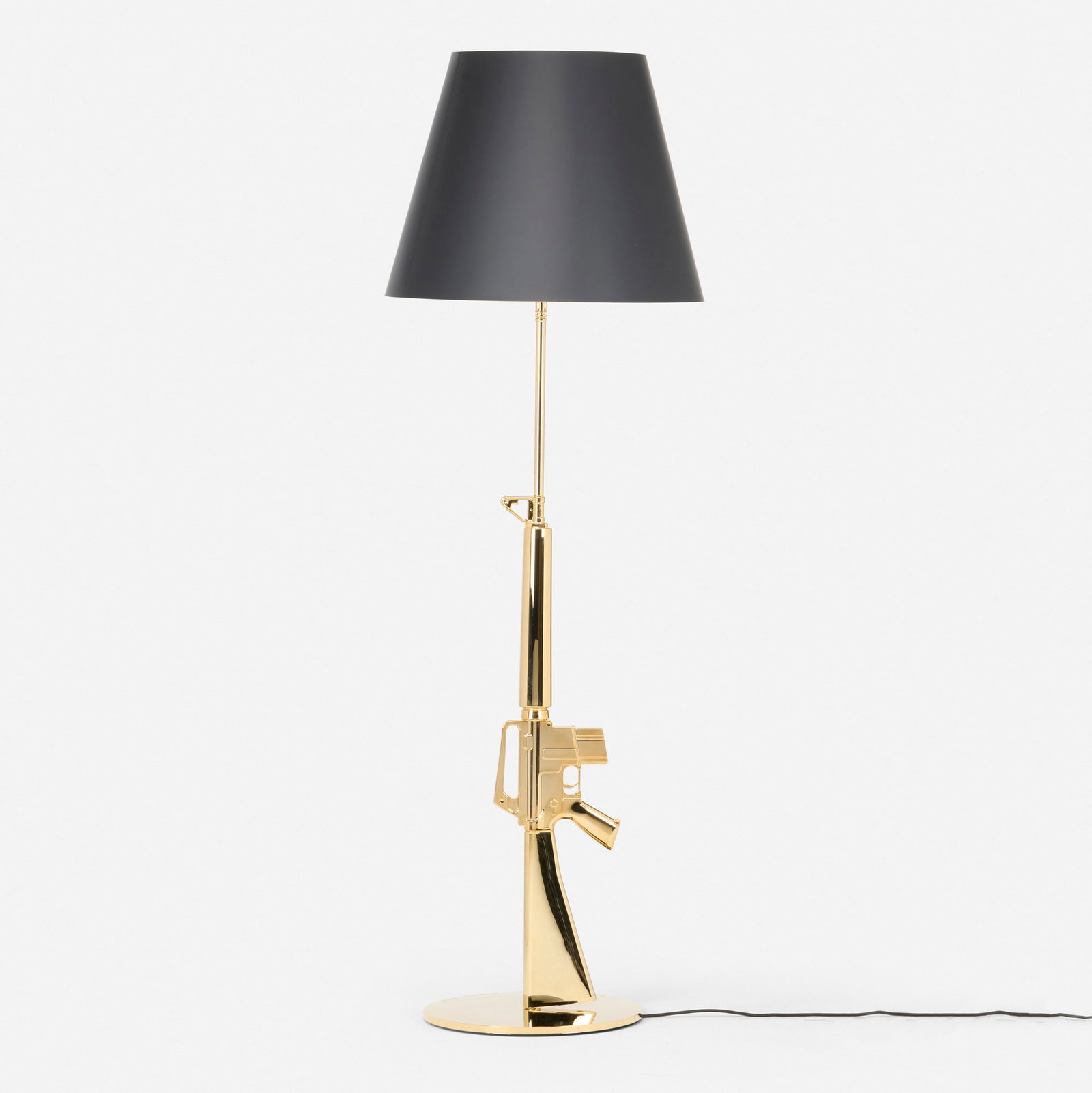 Philippe Starck, Golden Gun floor lamp: Philippe Starck Golden Gun floor lamp Flos France, 2005 gilt aluminum with polymer coating, gilt steel, paper shade 67 h x 21.75 dia in (170 x 55 cm) Manufacturer's label to underside 'Flos