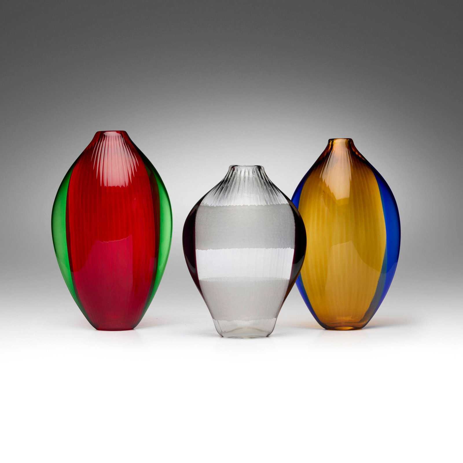 Laura de Santillana, Patagonia vases, set of three: Laura de Santillana Patagonia vases, set of three Eos 1992, 1993 hand-blown glass 11.375 h x 7 w x 4.625 d in (29 x 18 x 12 cm) 10.75 h x 6.625 w x 4.375 d in (27 x 17 x 11 cm) 9.25 h x 6.75 w x