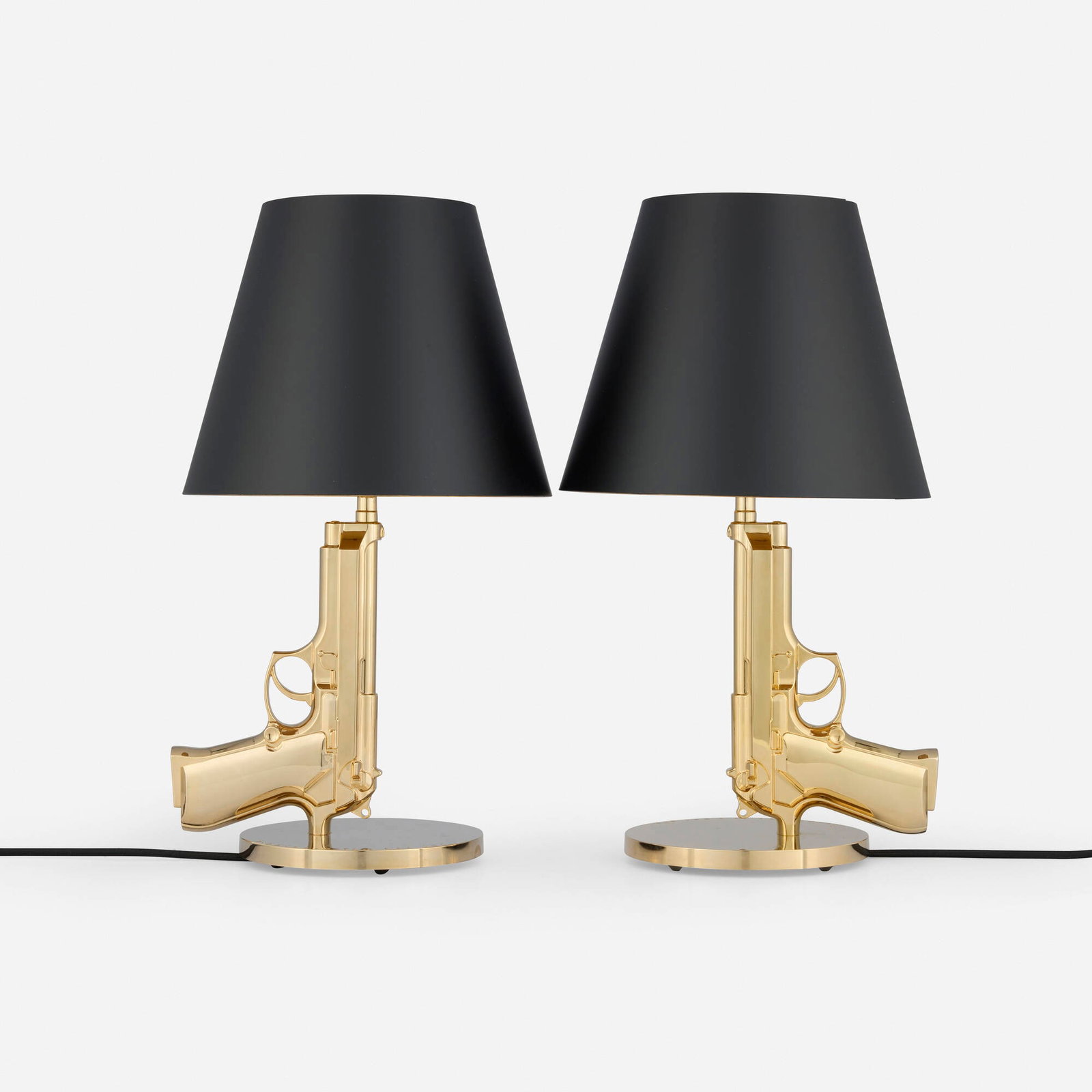Philippe Starck, Golden Gun table lamps, pair: Philippe Starck Golden Gun table lamps, pair Flos France / Italy, 2005 gilt aluminum with polymer coating, gilt steel 17 h x 8.25 w x 6.25 d in (43 x 21 x 16 cm) Decal manufacturer's labels to