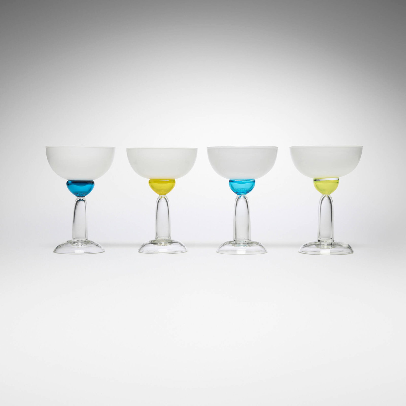 Marco Zanini, Beltegeuse glasses, set of four: Marco Zanini Beltegeuse glasses, set of four Toso Vetri d'Arte for Memphis Italy, 1983 glass 8 h x 5.5 dia in (20 x 14 cm) Incised to edge of base of three examples 'Memphis Milano by Toso Vetri