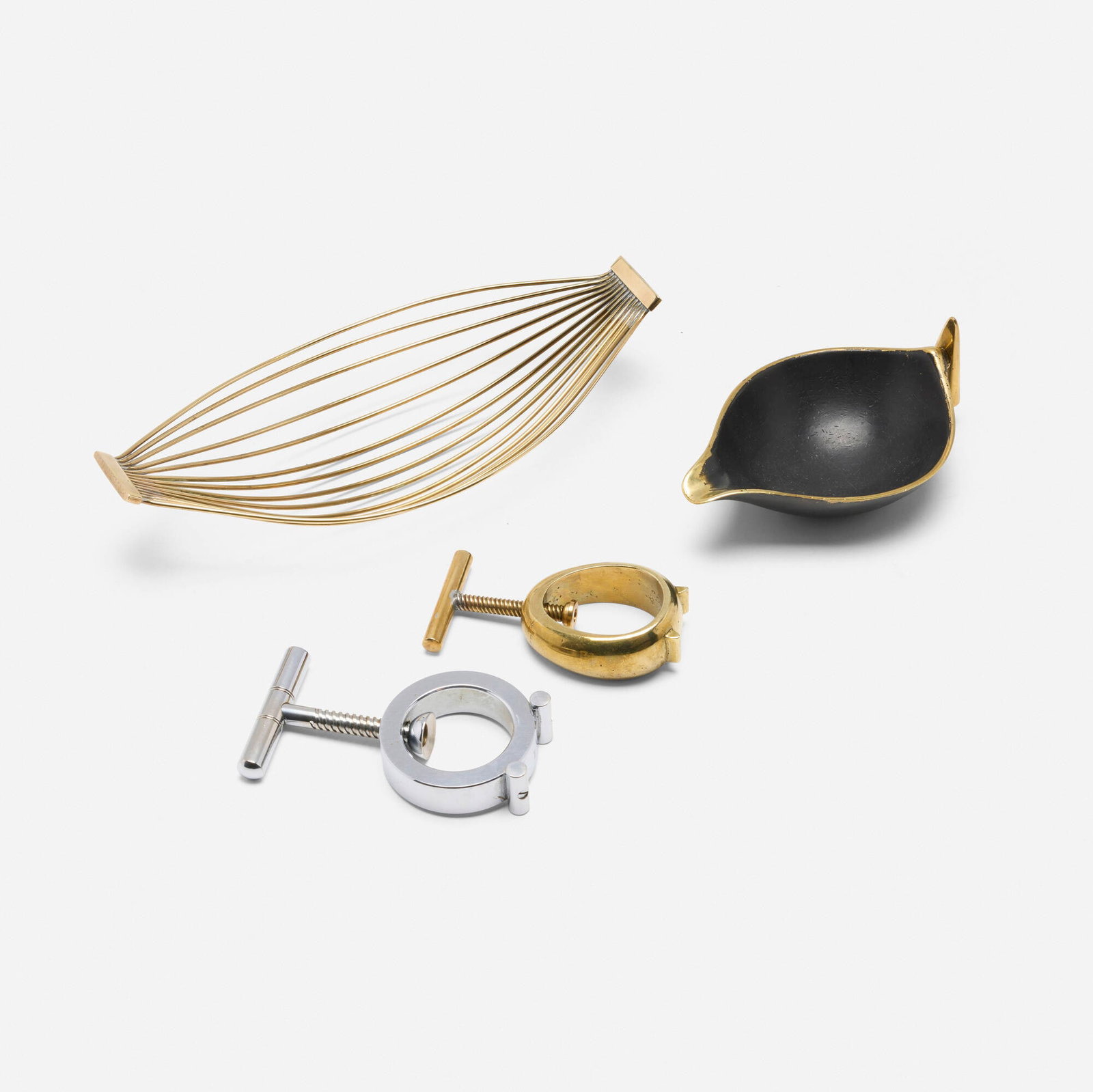 Carl Aubock II, Collection of four tabletop accessories: Carl Aubock II Collection of four tabletop accessories Werkstatte Carl Aubock Austria, c. 1950 brass, chrome-plated steel, patinated brass largest: 2.25 h x 10.5 w x 5 d in (6 x 27 x 13 cm) smallest: