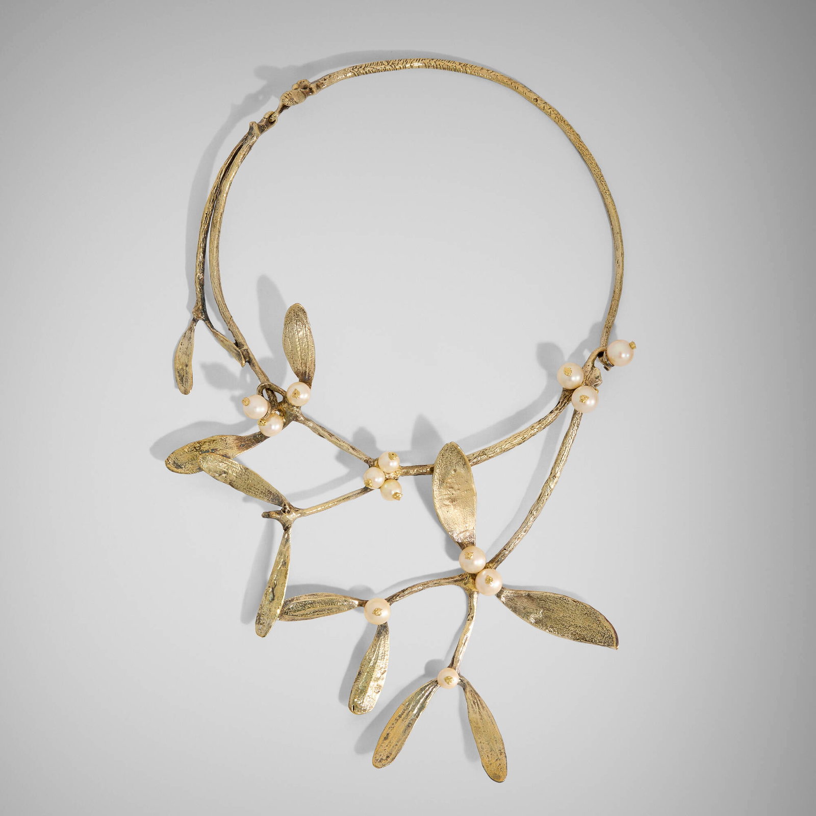 Claude Lalanne, Gui necklace: Claude Lalanne Gui necklace Artcurial France, 1985 gilt silver, cultured pearl decoration: 6.125 h x 6 w in (16 x 15 cm) neck piece: 15.5 l in (39 cm) Stamped signature and number to inside of
