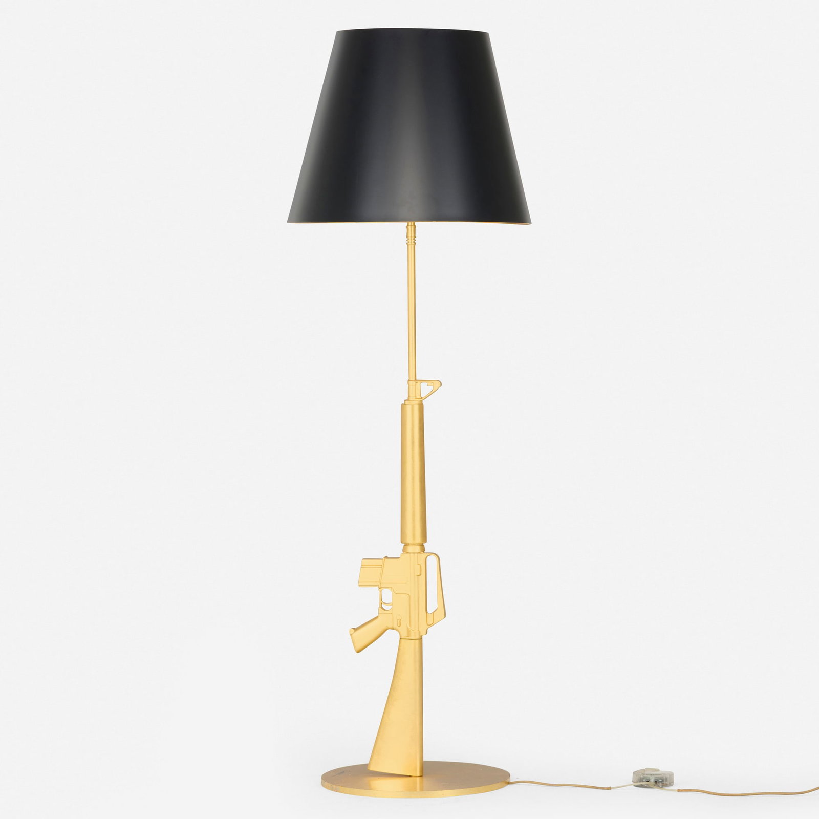 Philippe Starck, Gun floor lamp: Philippe Starck Gun floor lamp Flos France / Italy, 2005 gold leaf over aluminum and steel 66.5 h x 22 dia in (169 x 56 cm) Signed to base 'Starck'. Inscribed to edge of base 'Happiness is a Hot