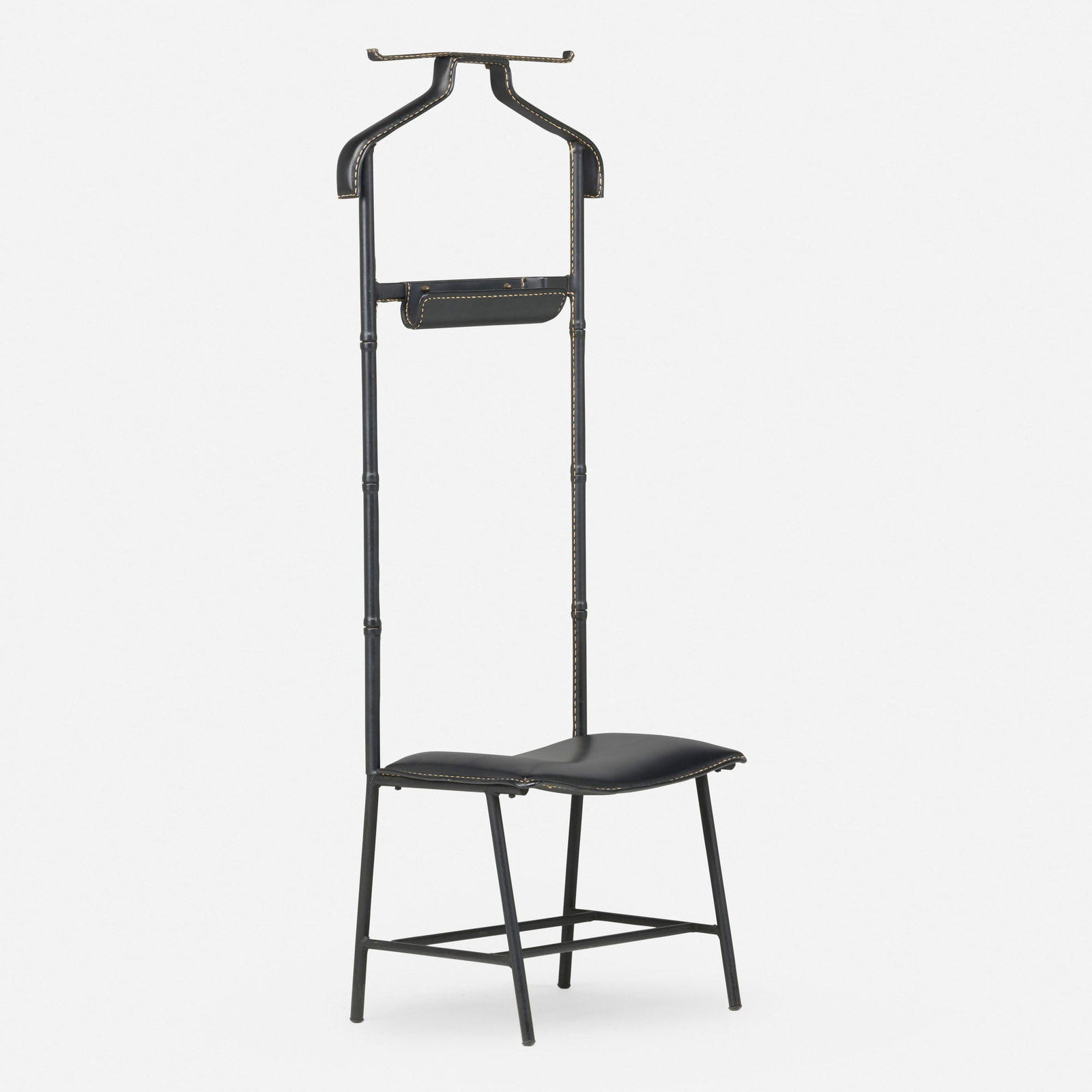 In the manner of Jacques Adnet, Valet chair: In the manner of Jacques Adnet Valet chair c. 1950 saddle-stitched leather, enameled steel, brass 50 h x 17.875 w x 12.5 d in (127 x 45 x 32 cm) This work will ship from Lambertvil