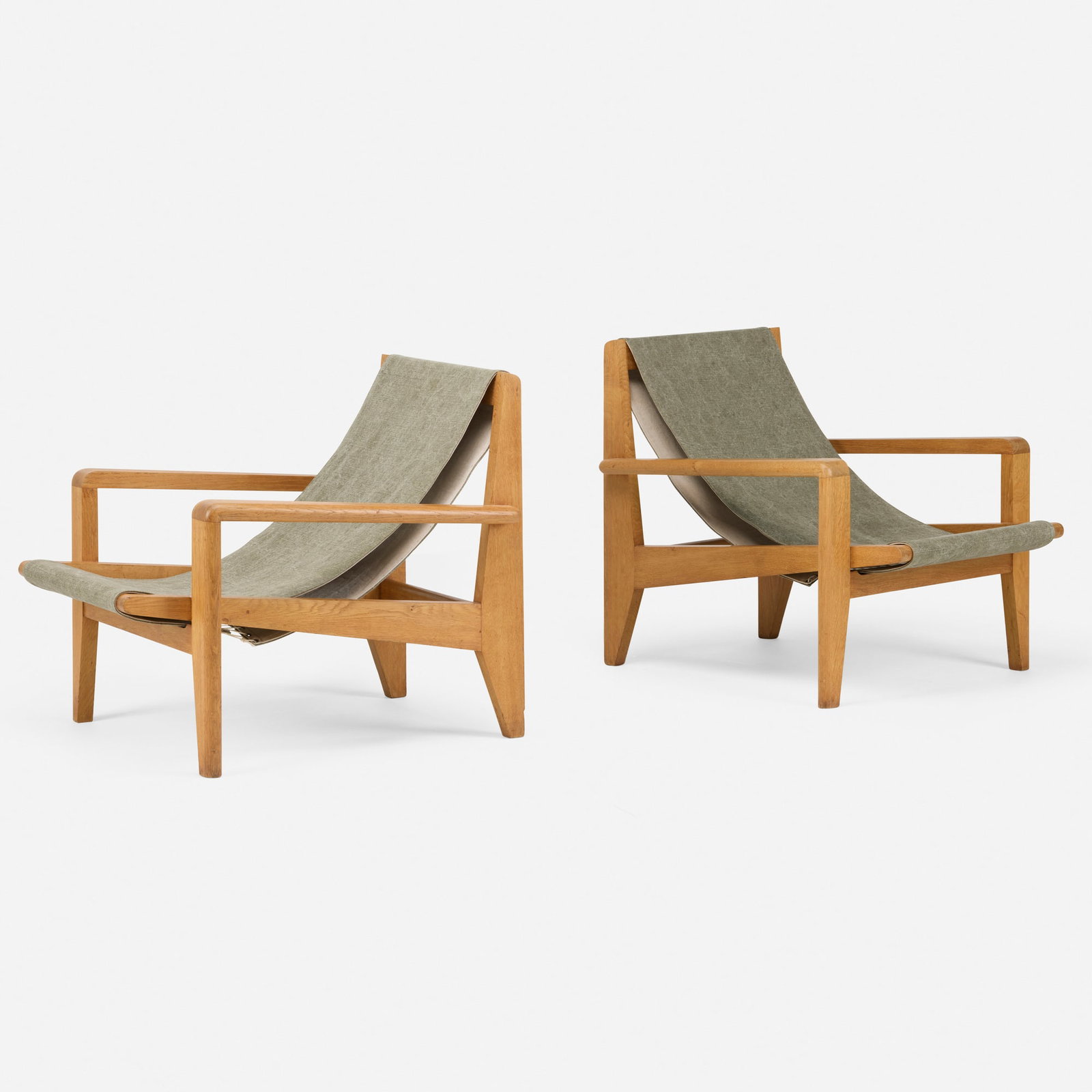 Andre Renou and Jean-Pierre Genisset, Armchairs from Hotel Normandie, Le Havre, pair: Andre Renou and Jean-Pierre Genisset Armchairs from Hotel Normandie, Le Havre, pair France, 1949 oak, canvas, brass 30 h x 28.25 w x 35.5 d in (76 x 72 x 90 cm) This design was exhibited at the