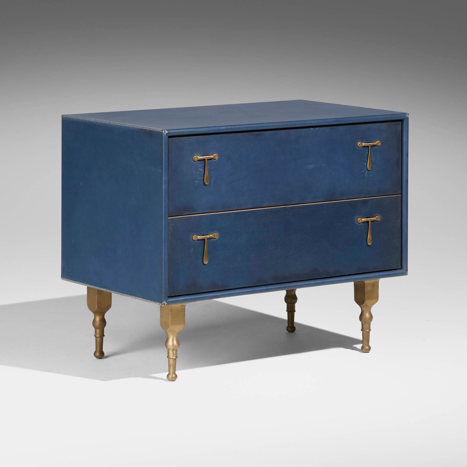 Tyler Hays, Captain's occasional table: Tyler Hays Captain's occasional table BDDW USA, 2022 leather over hardwood, cast bronze, walnut 26 h x 31.5 w x 19.25 d in (66 x 80 x 49 cm) Table features two drawers. Embossed leather ma