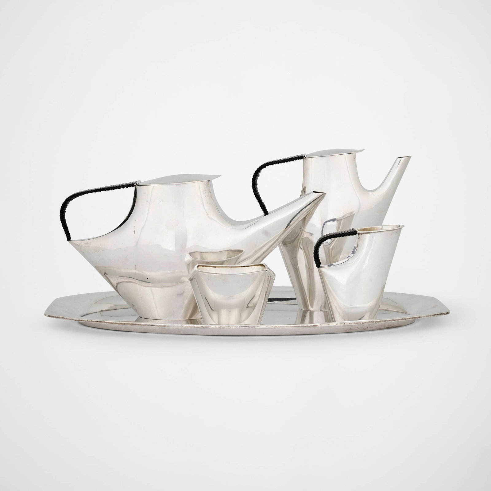 Lino Sabattini, Como coffee and tea service: Lino Sabattini Como coffee and tea service Christofle Italy, 1956 silver, plastic largest: 6 h x 12 w x 3 d in (15 x 30 x 8 cm) smallest: 2.75 h x 4 w x 2.75 d in (7 x 10 x 7 cm) Service is comprised