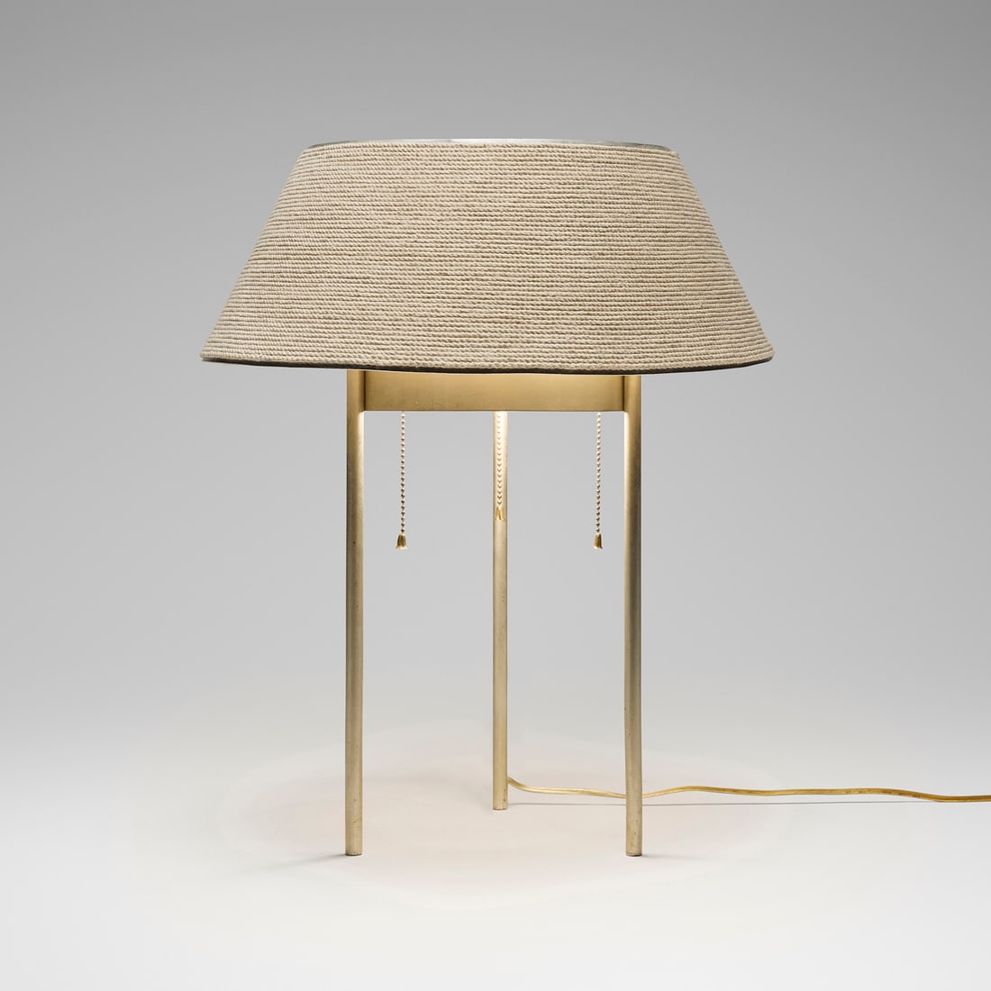 Benjamin Baldwin, Table lamp, model 187: Benjamin Baldwin Table lamp, model 187 Hansen USA, c. 1950 aluminum, steel, cotton rope-wrapped linen shade 20.5 h x 16.5 dia in (52 x 42 cm) Provenance: Private Collection Literature: Modern