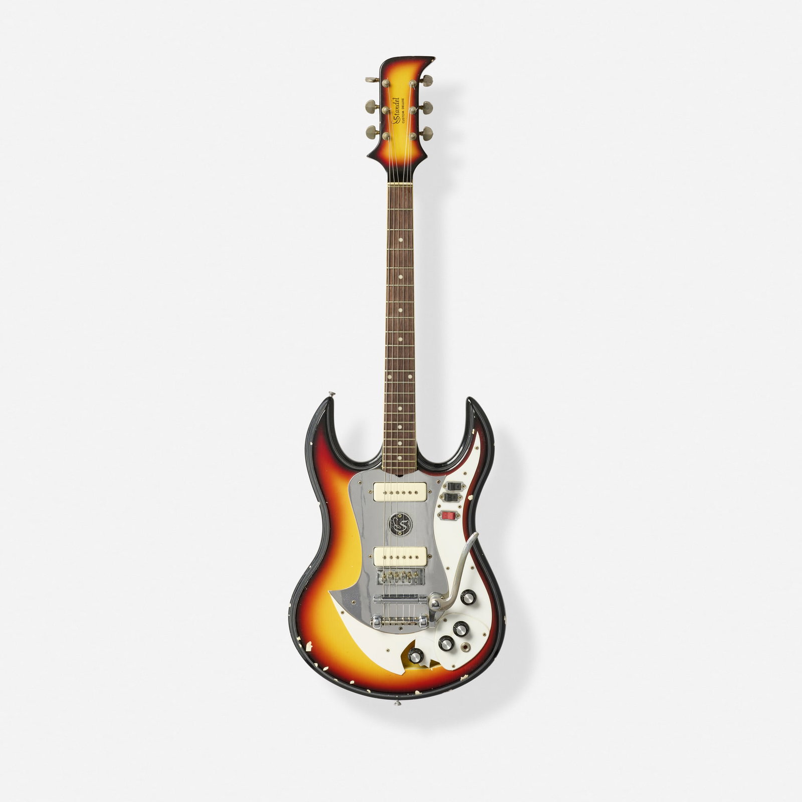 Standel, Custom Deluxe Solidbody Electric Guitar, c. 1966: Standel Custom Deluxe Solidbody Electric Guitar, c. 1966 Bakersfield, USA German-carved body, vibrato tailpiece Finish: Sunburst Serial number: 11-74 Sold with original hardshell case.
