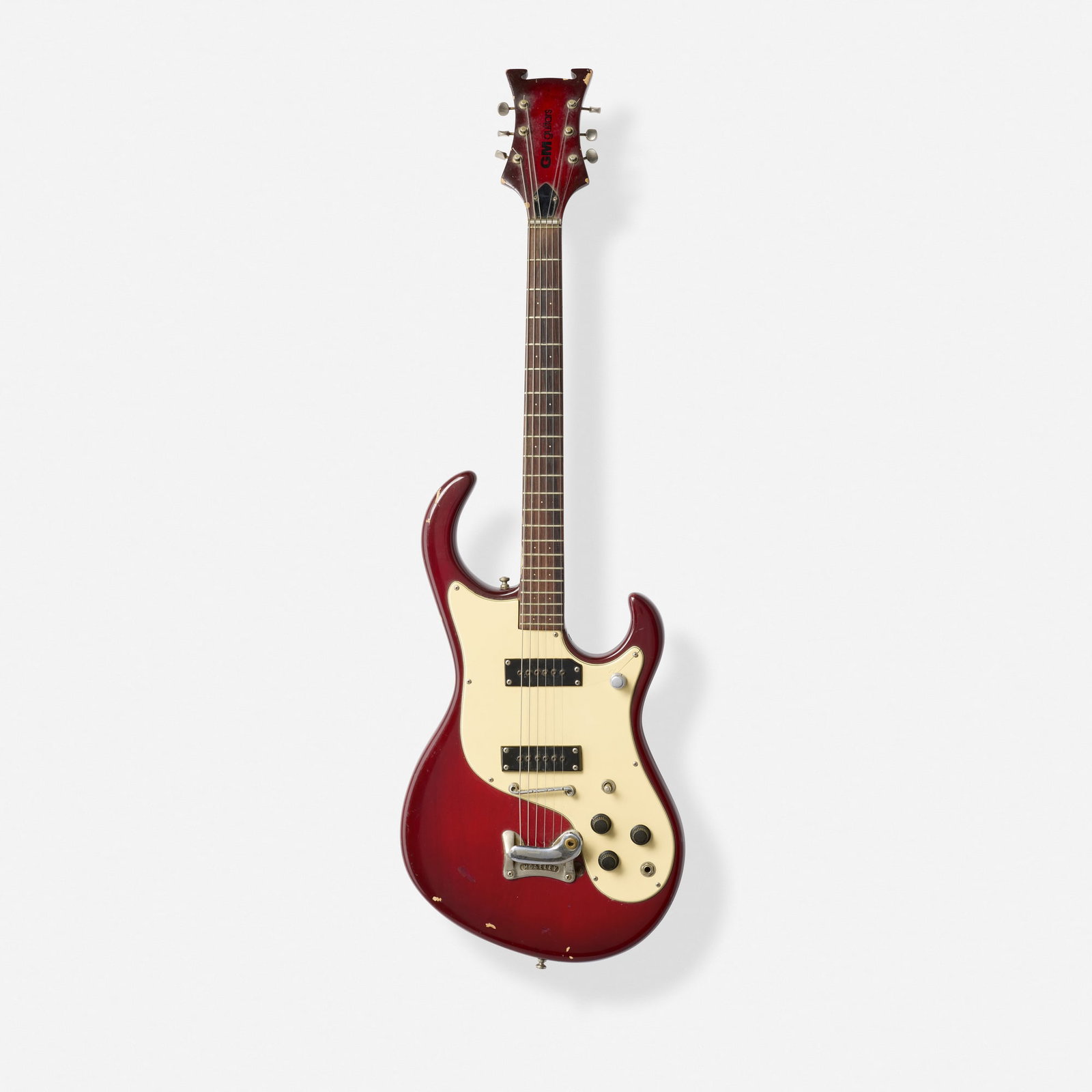 Gruggett, Longhorn Solidbody Electric Guitar, 1961: Gruggett Longhorn Solidbody Electric Guitar, 1961 Bakersfield, USA Set neck, single-coil pickups, aluminum bar bridge; with unfinished husk in later case Finish: Cherryburst Sold with original