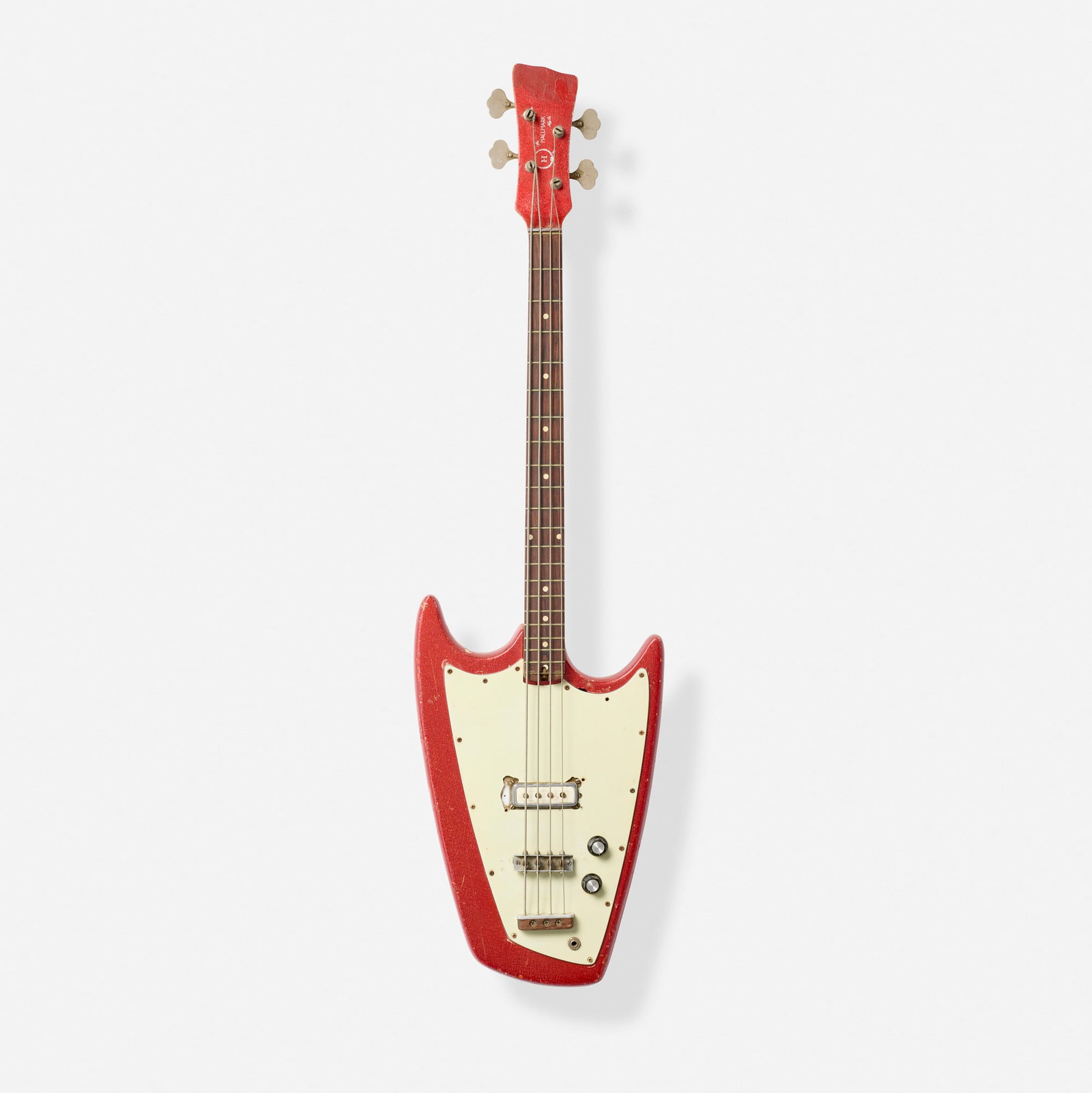 Hallmark Mfg. Co., Swept Wing Solidbody Electric Bass Guitar, 1966: Hallmark Mfg. Co. Swept Wing Solidbody Electric Bass Guitar, 1966 Arvin, USA Bolt-on maple neck with matching headstock (front and back) Finish: Red Sparkle Sold with original hardshell case.<