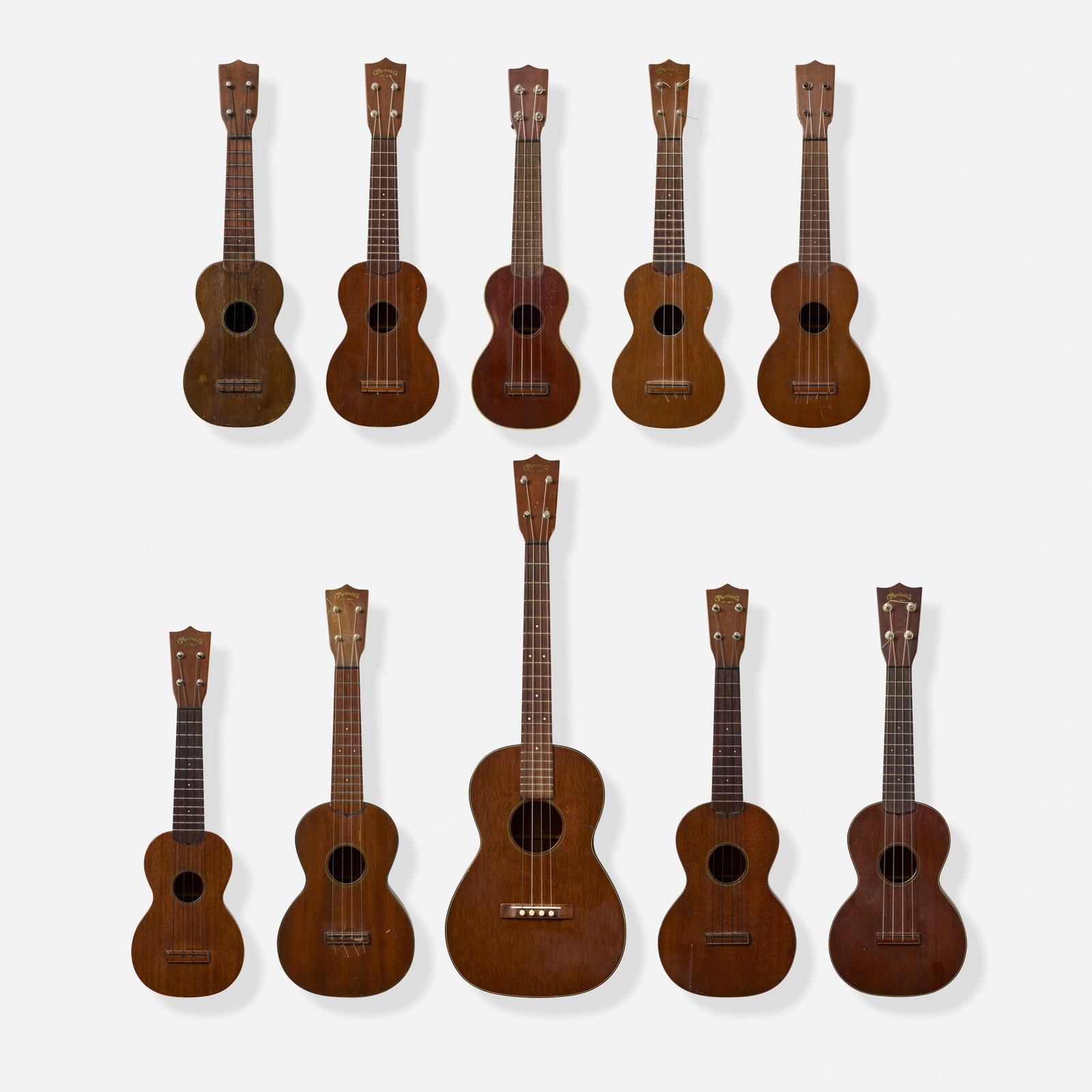 C.F. Martin & Co., Collection of Ten Soprano, Concert, and Baritone Ukuleles, c. 1920-1960: C.F. Martin & Co. Collection of Ten Soprano, Concert, and Baritone Ukuleles, c. 1920-1960 Nazareth, USA Mahogany, various styles, some with cases Finish: Brown Provenance: