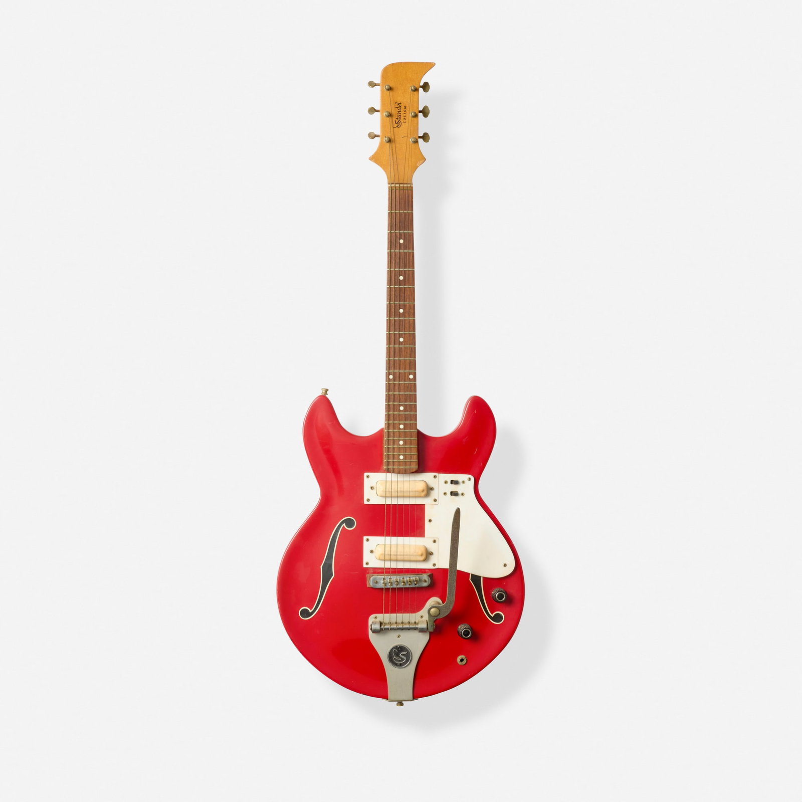 Standel, Custom Hollowbody Electric Guitar, c. 1966: Standel Custom Hollowbody Electric Guitar, c. 1966 Bakersfield, USA Fiberglass body, f-hole stickers, vibrato tailpiece Finish: Red Serial number: 2A-143 Sold with hardshell case.