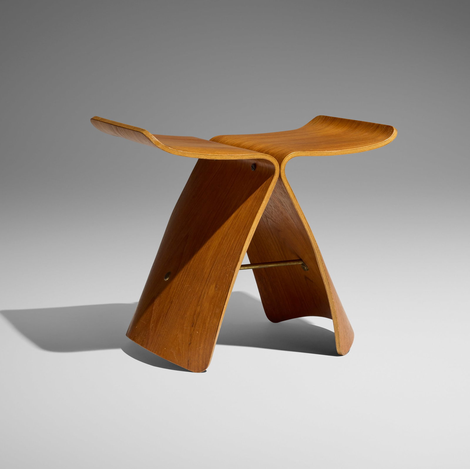Sori Yanagi, Butterfly stool: Sori Yanagi Butterfly stool Tendo Mokko Japan, 1954 teak plywood, brass 14.75 h x 17.25 w x 12.25 d in (37 x 44 x 31 cm) An example of this design is in the permanent collection of the