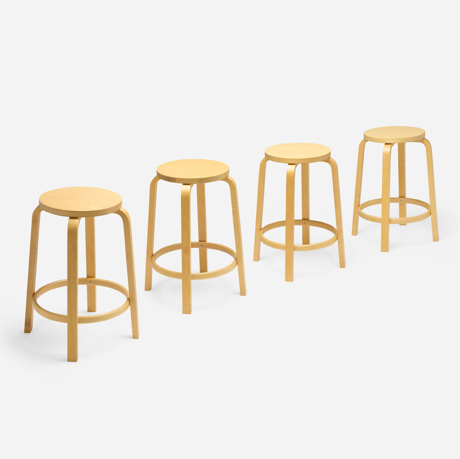Alvar Aalto, Barstools model 64, set of four: Alvar Aalto Barstools model 64, set of four Artek Finland, 1935 / 2007 birch 25.5 h x 17 dia in (65 x 43 cm) Decal manufacturer label to underside of each example 'Original Alvar Aalt