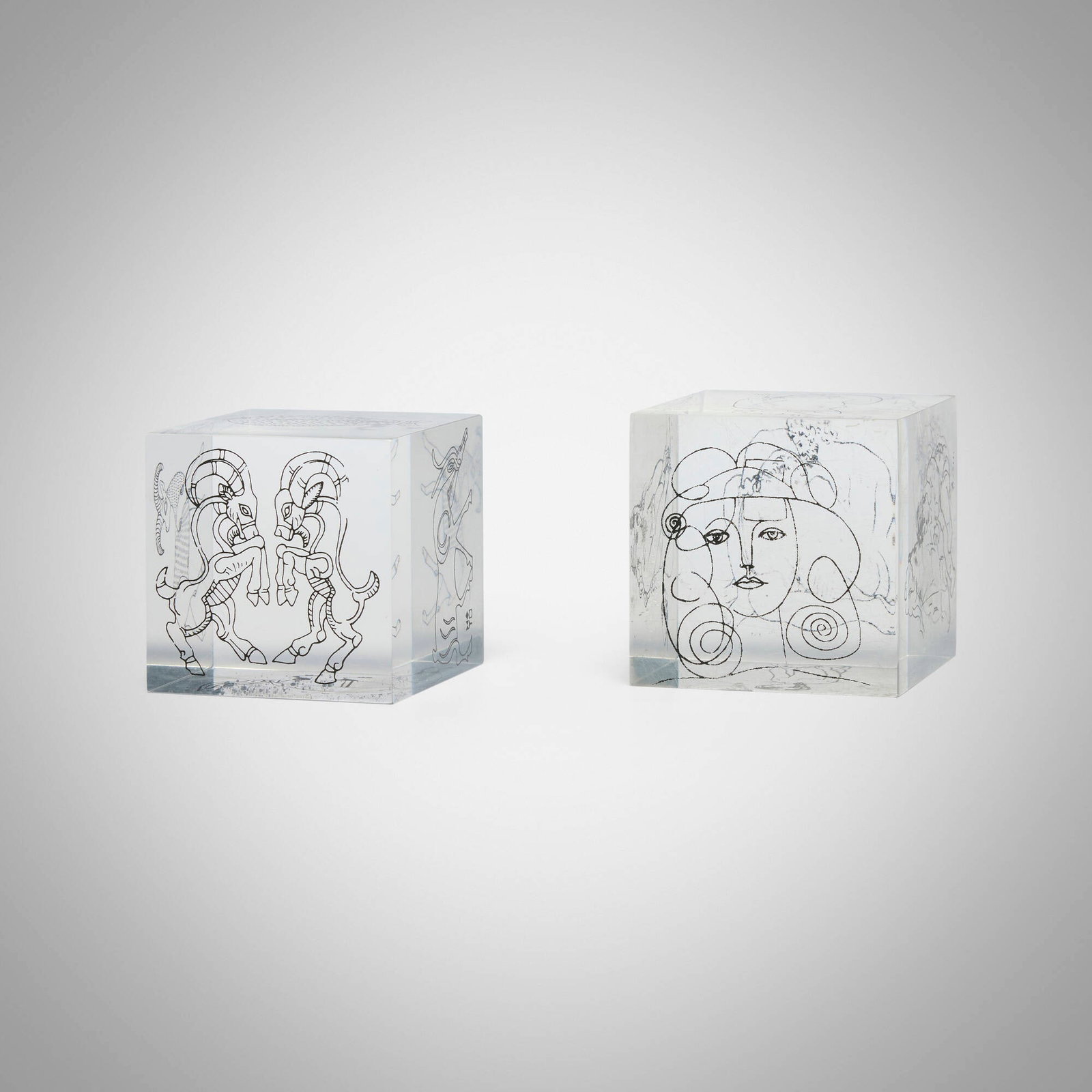 Paperweights, set of two: Paperweights, set of two c. 1965 screenprint on acrylic 2.5 h x 2.5 w x 2.5 d in (6 x 6 x 6 cm) Lot is comprised of one After Pablo Picasso paperweight and one zodiac paperweight by Scopus created