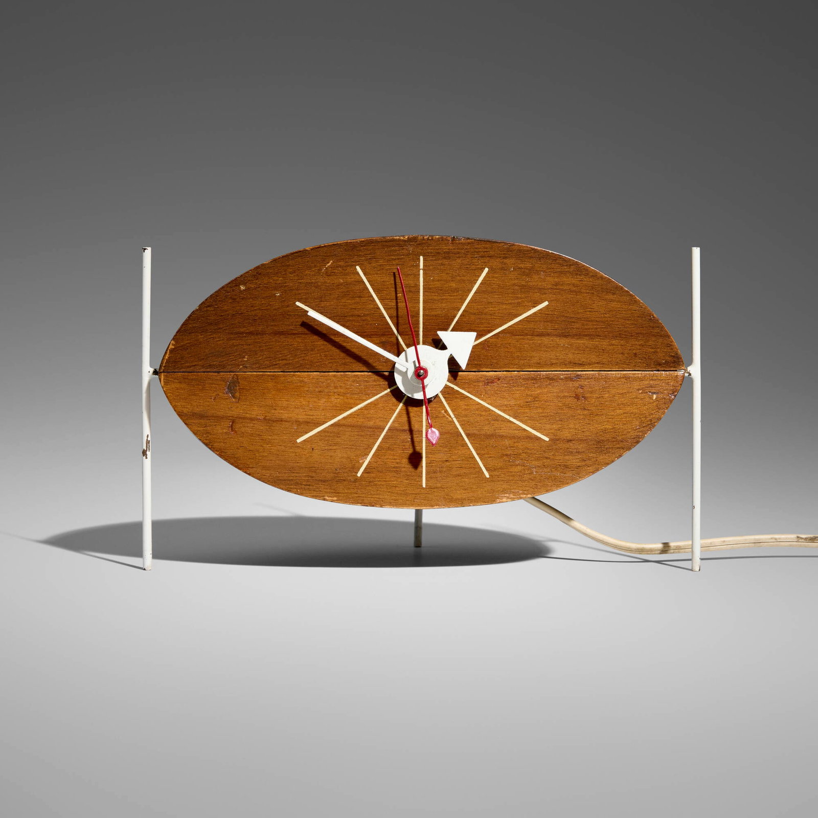 George Nelson & Associates, Watermelon table clock, model 2219D: George Nelson & Associates Watermelon table clock, model 2219D Howard Miller Clock Company USA, 1954 walnut, enameled steel and metal 4.5 h x 8 w x 4.25 d in (11 x 20 x 11 cm) Decal manufa