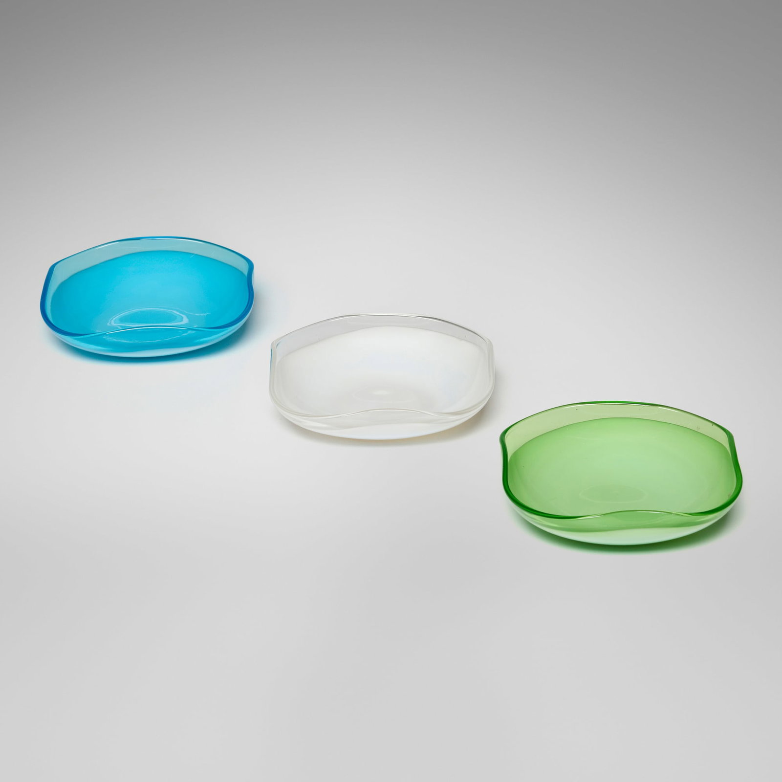 Sasaki, Ashtrays, set of three: Sasaki Ashtrays, set of three Japan, c. 1970 glass 1.25 h x 4.5 w x 4.5 d in (3 x 11 x 11 cm) Etched manufacturer's mark to underside of each example 'SS'. This work will ship from
