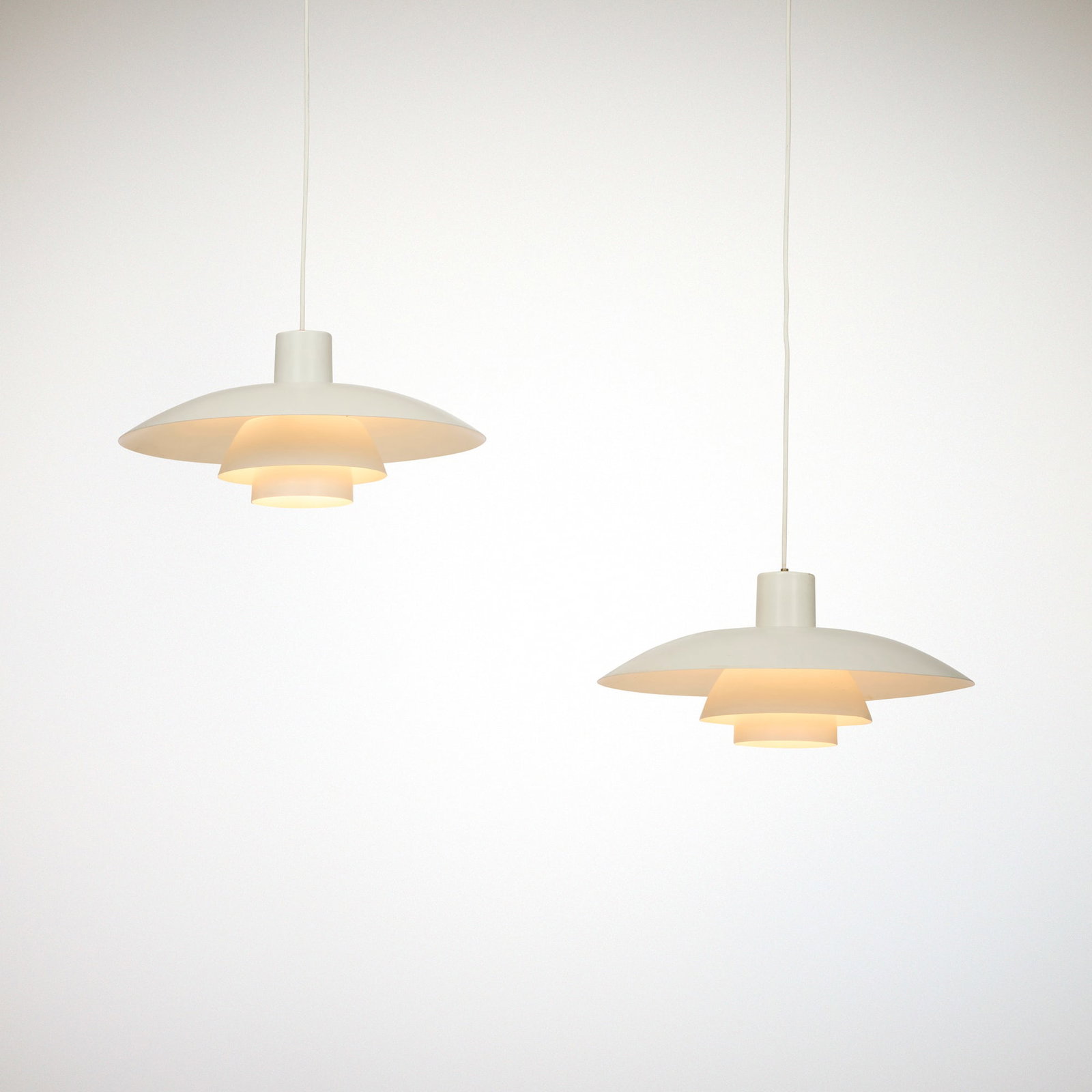 Poul Henningsen, PH 4/3 pendant lamp canopies, pair: Poul Henningsen PH 4/3 pendant lamp canopies, pair Louis Poulsen Denmark, 1927 / c. 1975 lacquered aluminum 7.25 h x 16 dia in (18 x 41 cm) Paper manufacturer's label to interior of o