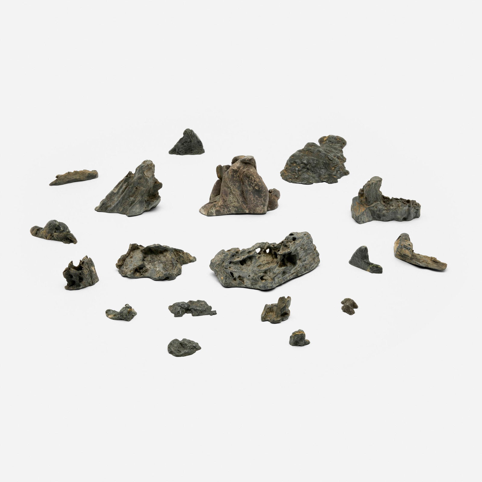 Japanese, Collection of eighteen miniature mountain sculptures: Japanese Collection of eighteen miniature mountain sculptures 20th century stone largest: 2.25 h x 6 w x 3 d in (6 x 15 x 8 cm) smallest: 0.5 h x 1 w x 0.5 d in (1 x 3 x 1 cm) T