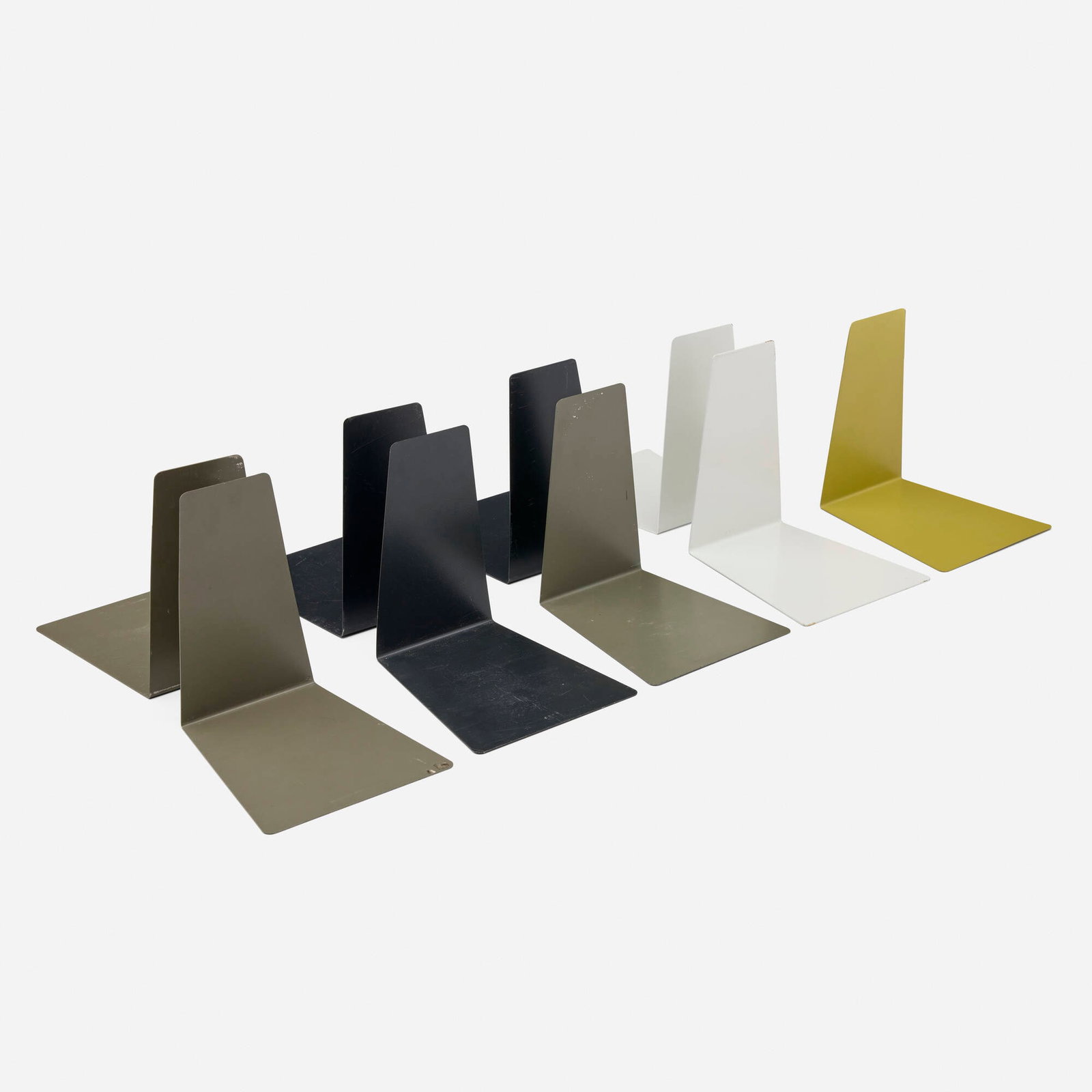 Soennecken, Bookends, set of nine: Soennecken Bookends, set of nine Germany, c. 1965 enameled steel 5.75 h x 5.5 w x 4.5 d in (15 x 14 x 11 cm) Impressed manufacturer's mark to underside of three examples 'Soennecken'.