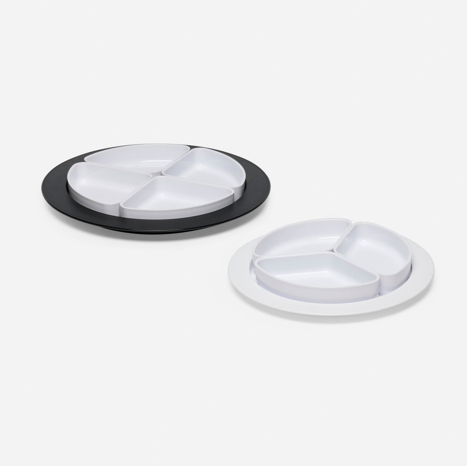 Timo Sarpaneva, More segmented serving trays, set of two: Timo Sarpaneva More segmented serving trays, set of two OPA Finland, c. 1970 plastic 1.5 h x 14.375 dia in (4 x 37 cm) 1.5 h x 11 dia in (4 x 28 cm) Decal manufacturer's label to underside of