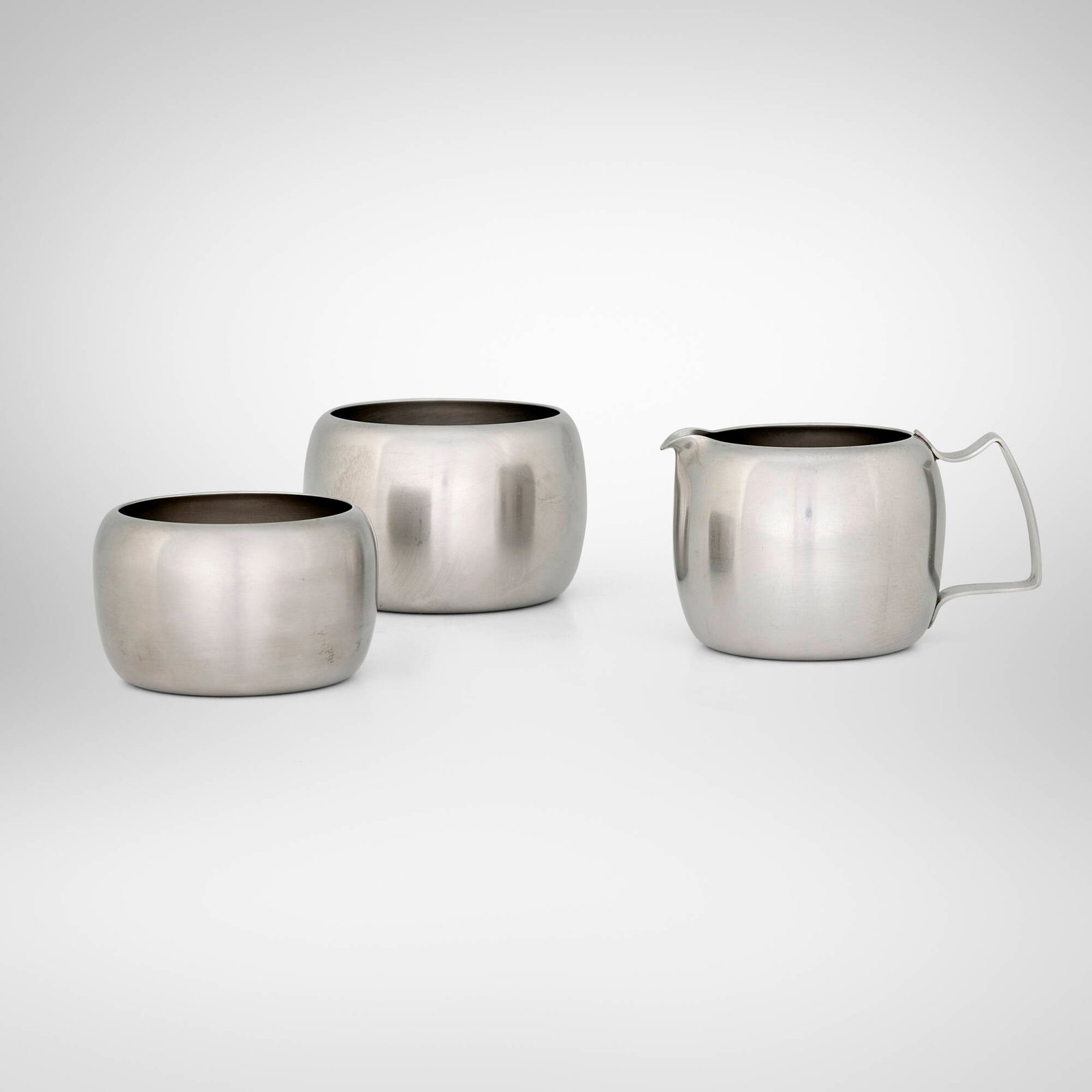 Old Hall, Creamer and sugar bowls, set of two: Old Hall Creamer and sugar bowls, set of two United Kingdom, c. 1965 stainless steel creamer: 2.375 h x 4 w x 3 d in (6 x 10 x 8 cm) 8oz bowl: 2.25 h x 3.25 dia in (6 x 8 cm) 5oz bowl: 1.75 h x 3 dia