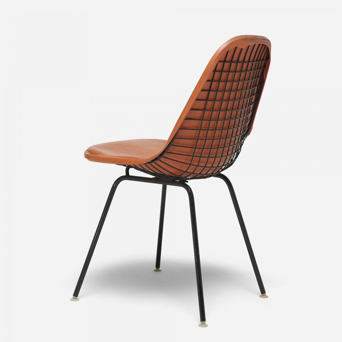 Charles and Ray Eames DKX: Charles and Ray Eames DKX Herman Miller USA, 1951 vinyl, enameled steel, plastic 19 w x 21 d x 32.5 h inches Signed with fabric manufacturer's label to cushion: [Herman Miller]. Literature: The Herman