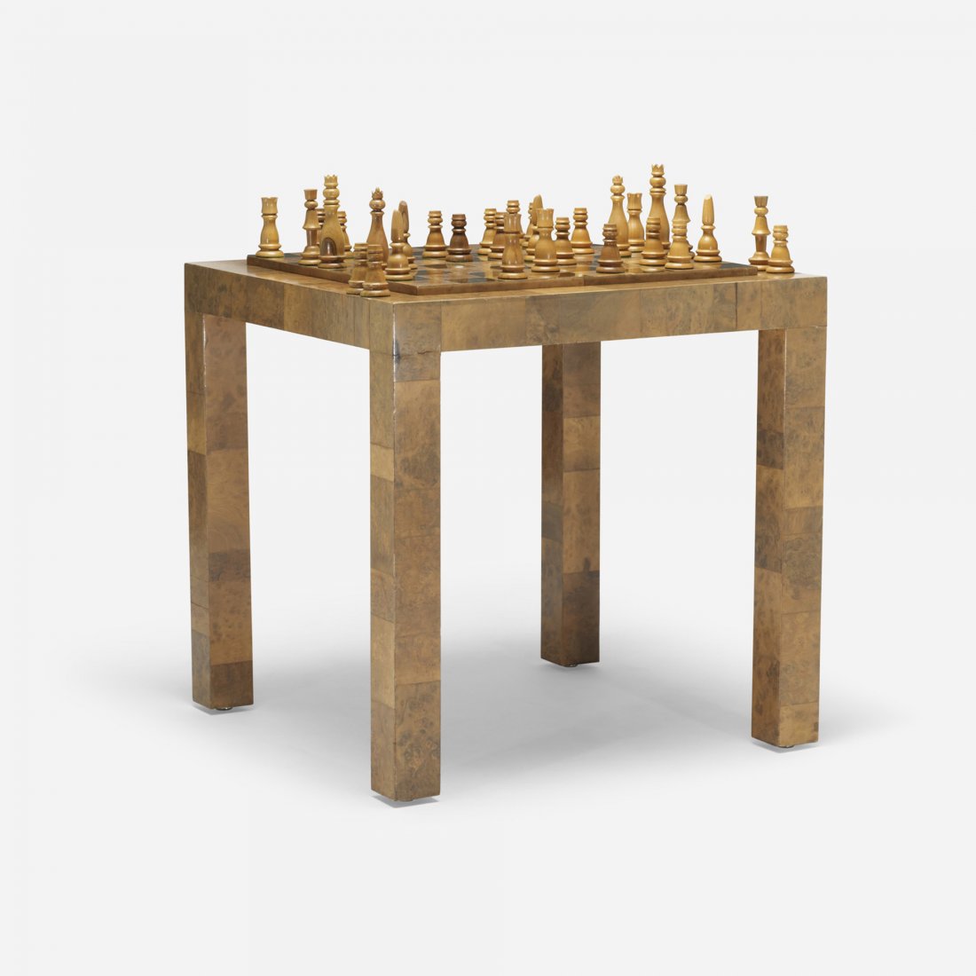 In the manner of Paul Evans game table: In the manner of Paul Evans game table USA, c. 1975 maple burl, brass 30 w x 30 d x 30 h inches Table features a backgammon board to one side and a chess board to the other. Sold with chess pieces.
