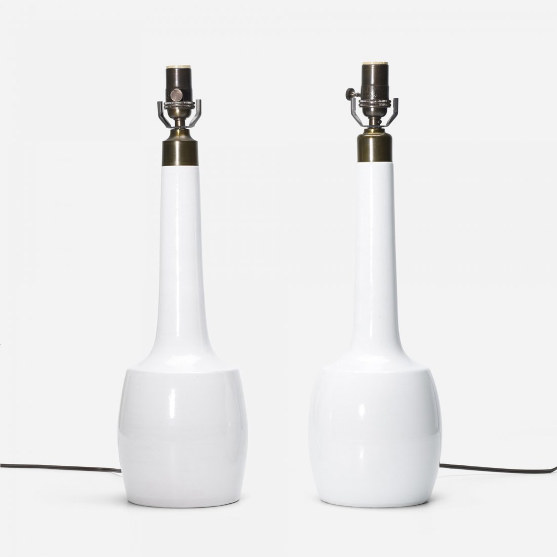 Esben Klint lamps, pair: Esben Klint lamps, pair Le Klint Denmark, c. 1950 glazed earthenware 5.5 dia x 21 h inches Incised signature to underside of each example: [Le Klint].