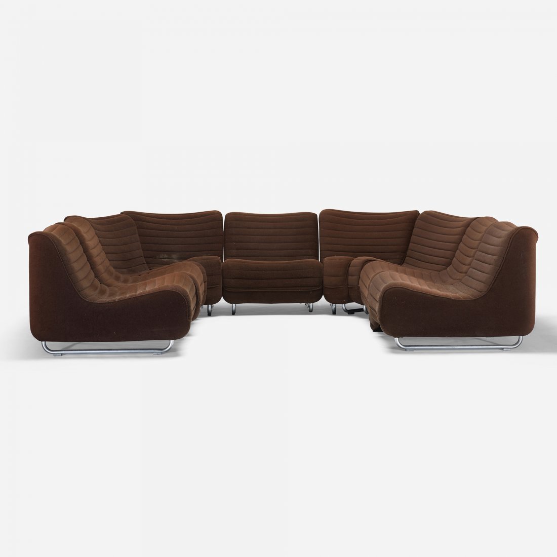 Modern sectional sofa: Modern sectional sofa c. 1975 upholstery, matte chrome-plated steel, plastic 27.5 w x 32 d x 24.5 h inches Sofa is compised of ten sections; smaller sections measure: 24.5 w x 32 d x 24.5 h inches.