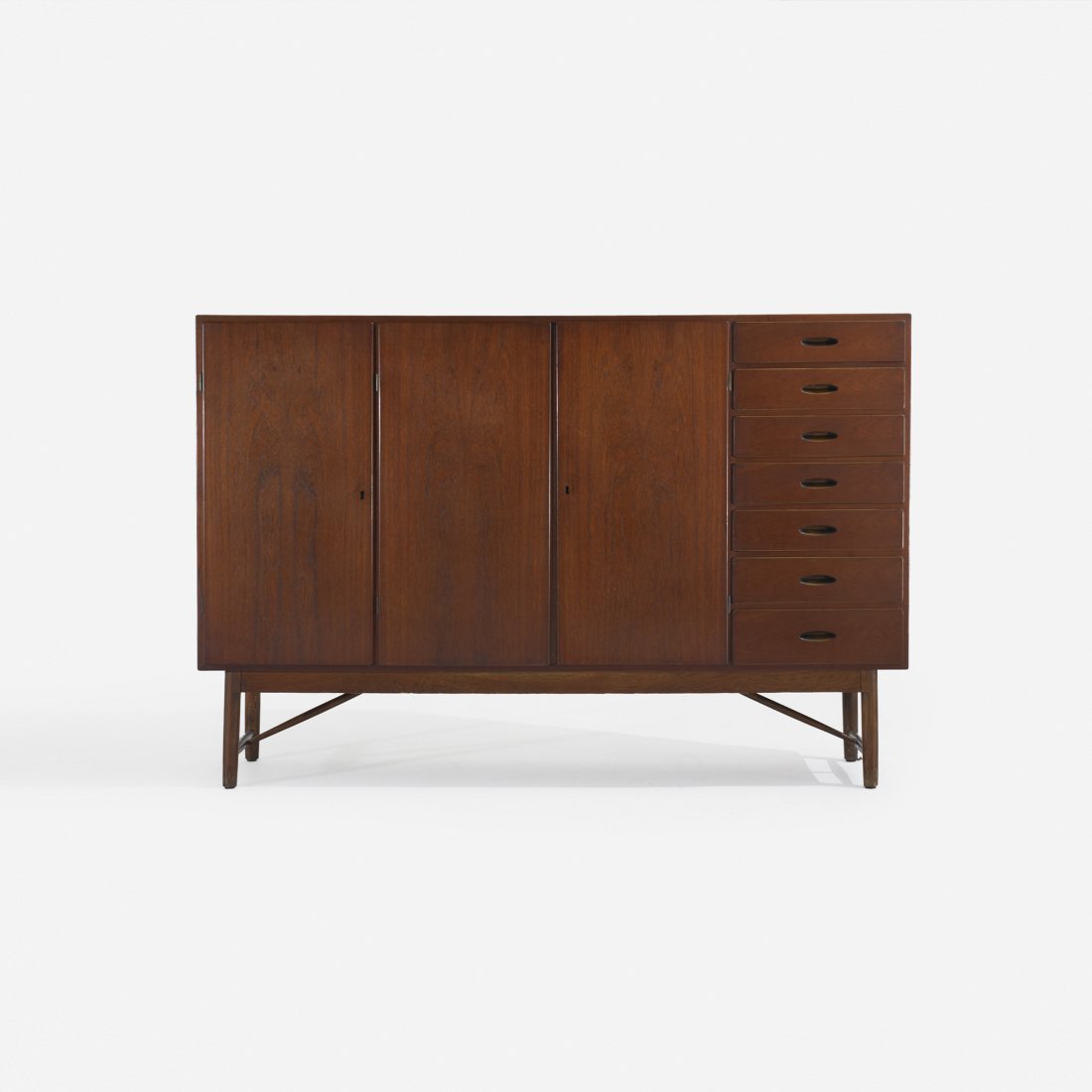 Børge Mogensen cabinet: Børge Mogensen cabinet Fredericia Stolefabrik Denmark, c. 1960 teak, stained oak 68.75 w x 16 d x 46 h inches Cabinet features seven drawers and three doors concealing two adjustable shelves and five