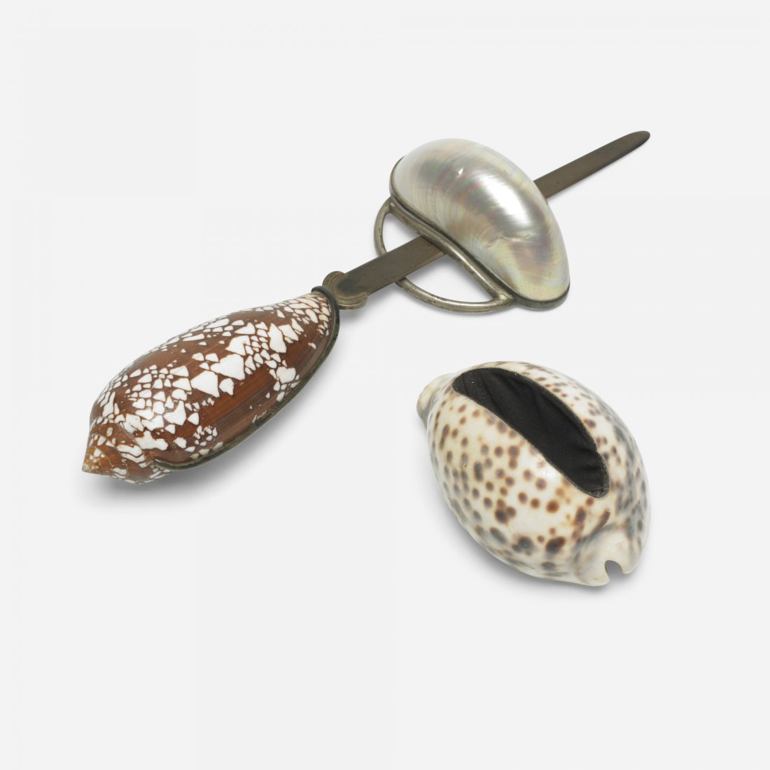 Marguerite Stix three-piece desk set: Marguerite Stix three-piece desk set Austria, c. 1960 sea shells, silver, brass, velvet 6 w x 4 d x 5.75 h inches Desk set features letter opener, pen rest and card holder.