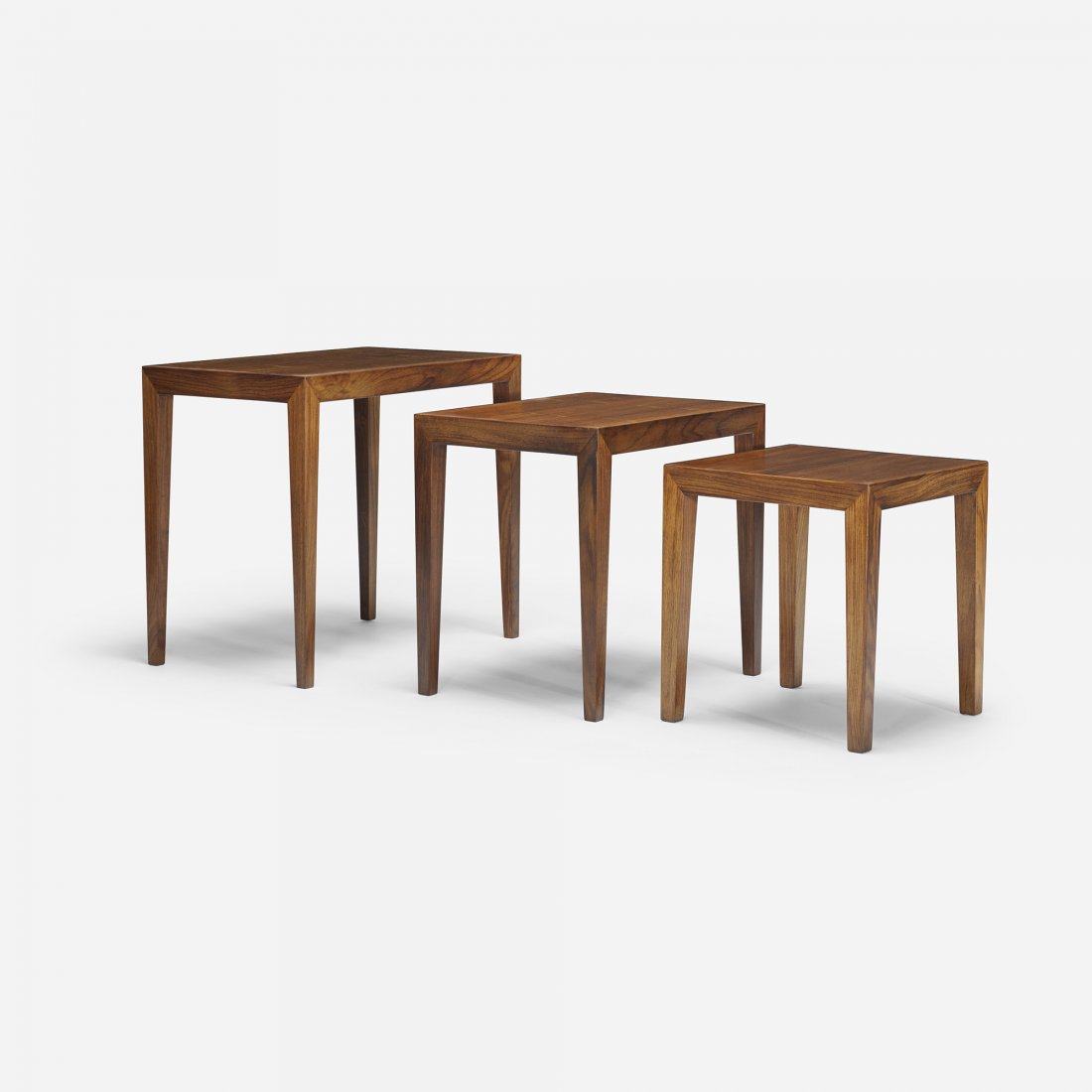 Ole Wanscher nesting tables, set of three: Ole Wanscher nesting tables, set of three Haslev Møbelsnedkeri A/S Denmark, c. 1965 rosewood 23 w x 14 d x 19.75 h inches Signed with paper decal manufacturer's label to underside of each example: [1