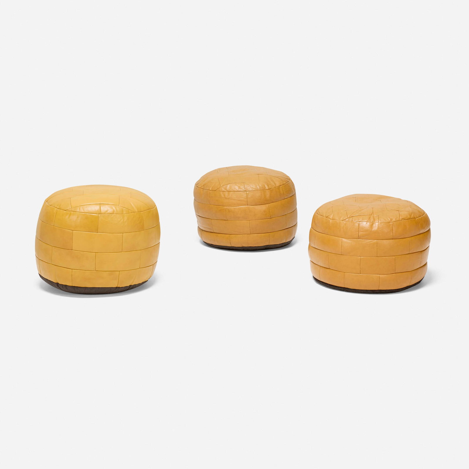 De Sede, DS 80 ottomans, set of three: De Sede DS 80 ottomans, set of three Switzerland, c. 1965 leather upholstery 16.5 h x 20 dia in (42 x 51 cm) 14.5 h x 19 dia in (37 x 48 cm) 14.5 h x 19 dia in (37 x 48 cm) This work will ship from