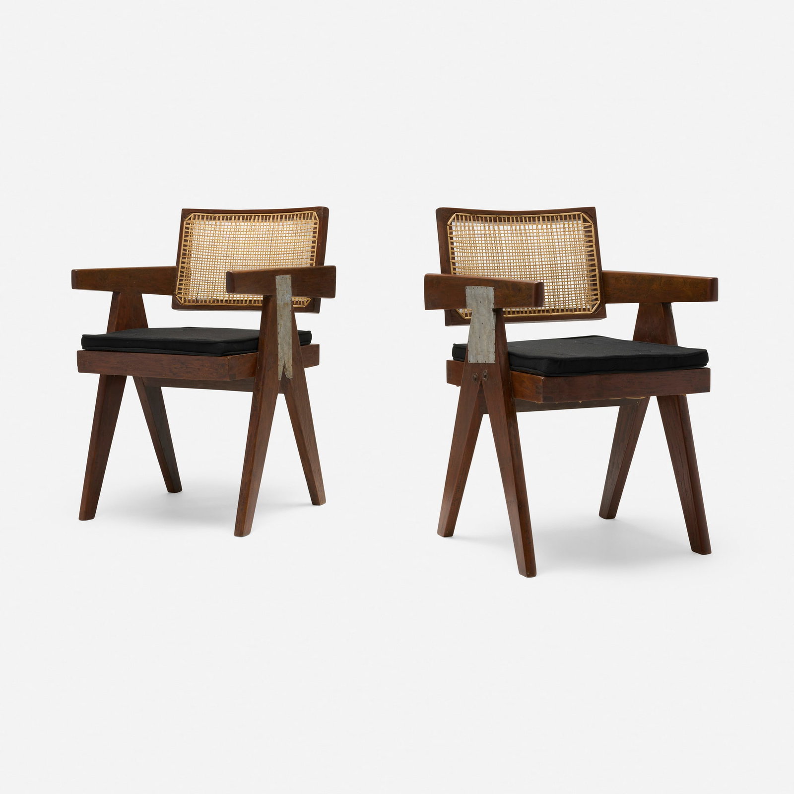 Pierre Jeanneret, Office chairs from Chandigarh, pair: Pierre Jeanneret Office chairs from Chandigarh, pair France/India, c. 1960 teak, zinc, cane, upholstery 31.75 h x 19.5 w x 19.5 d in (81 x 50 x 50 cm) Stencil marks to reverse of each example.