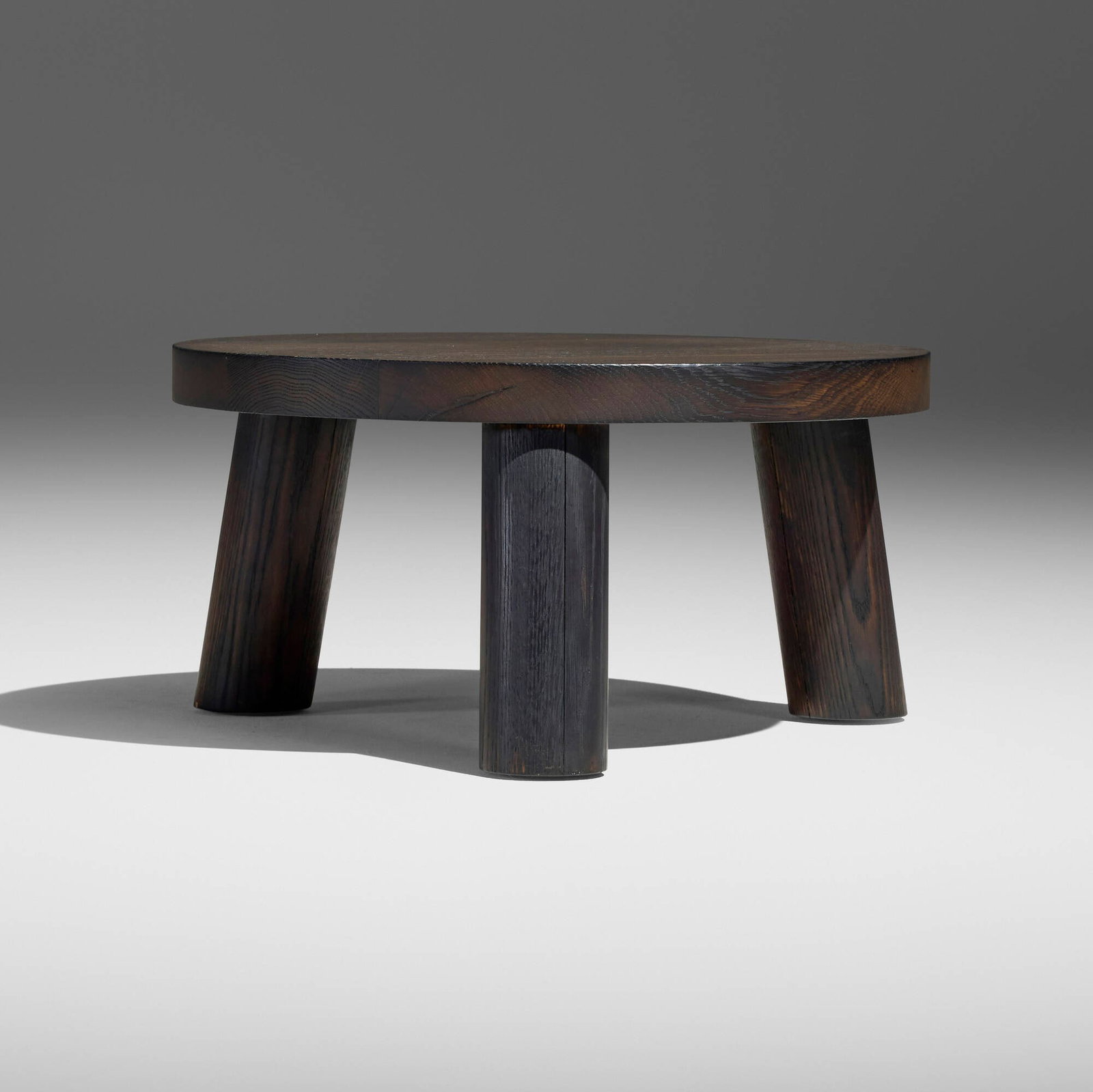 Christian Woo, Trifecta coffee table: Christian Woo Trifecta coffee table Spain/Canada, c. 2020 charred and oiled oak 11.75 h x 24.25 dia in (30 x 62 cm) Impressed manufacturer's mark to underside 'Christian Woo'. This