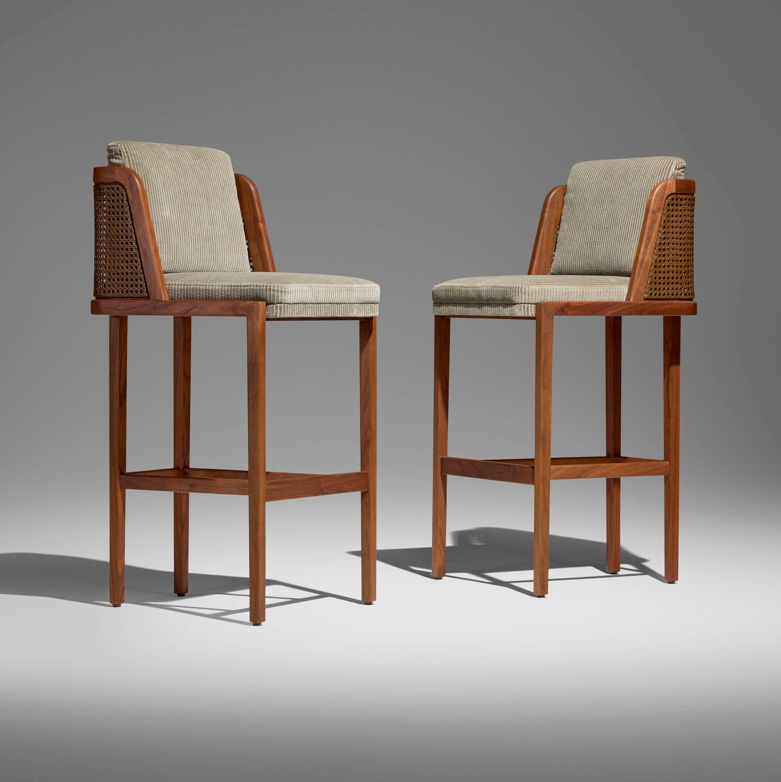 Autoban, Throne bar stools, pair: Autoban Throne bar stools, pair De La Espada Turkey / Portugal, c. 2020 walnut, upholstery, cane 42 h x 19.25 w in (107 x 49 cm) Metal manufacturer's labels to underside of each example